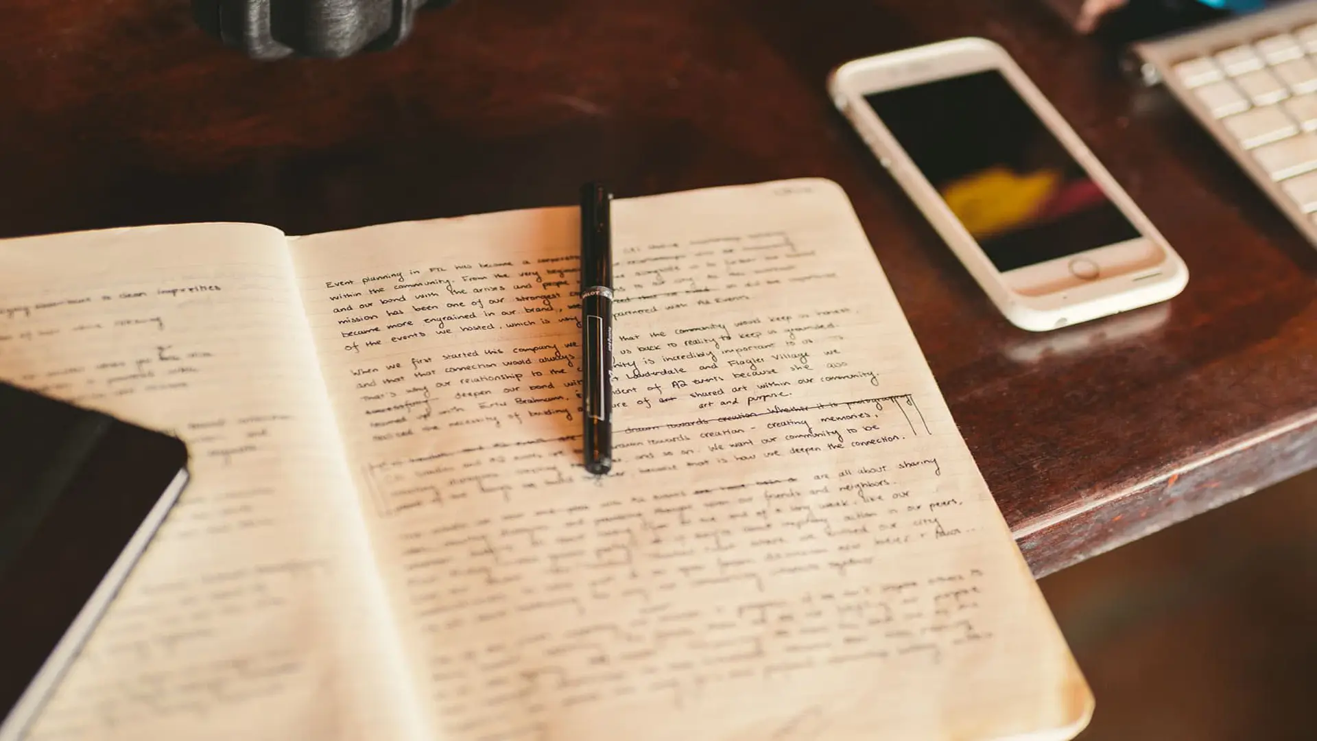 cis-post-top-ted-talks-on-storytelling4 Closeup of writing in a notebook with cell phone nearby