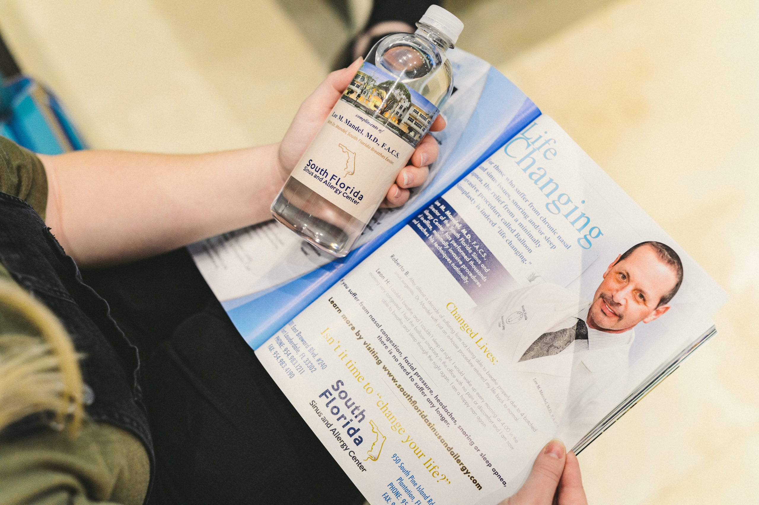 South Florida Sinus and Allergy Center Overhead view of woman holding a water bottle and magazine