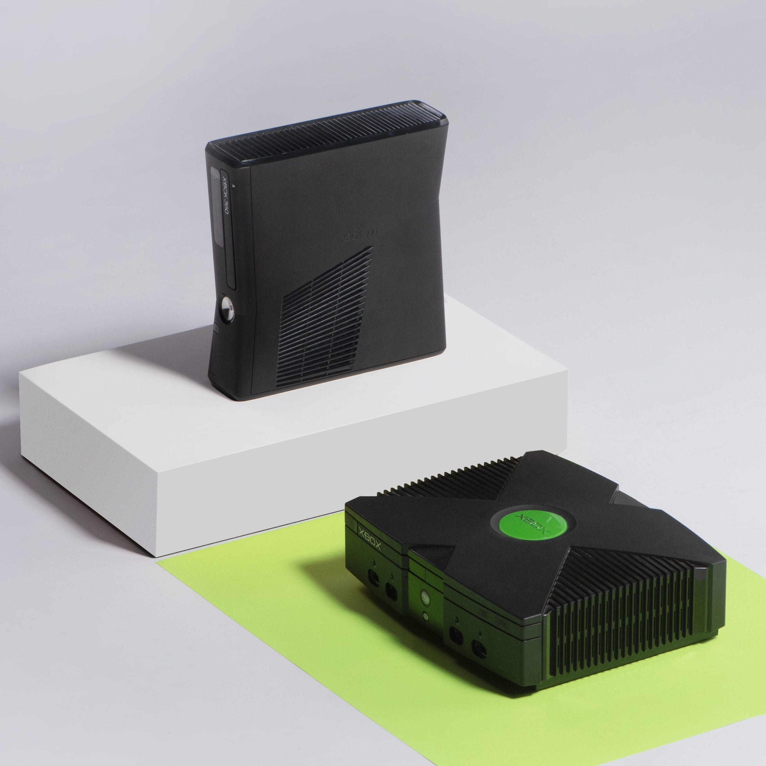 IU C&I Studios Portfolio Heart Piece Plus Isometric Photography Two XBox video consoles on display