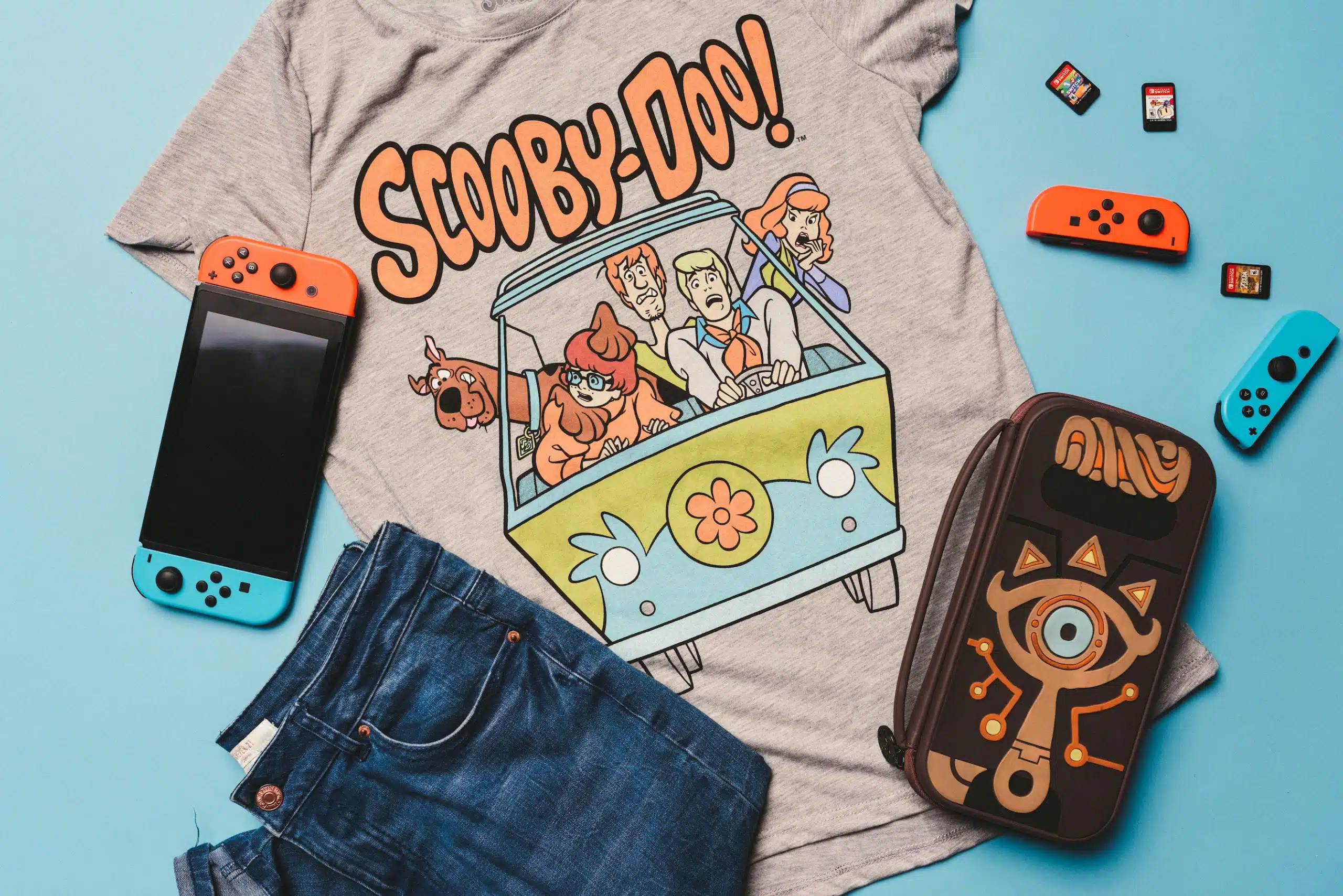 Heart Piece Plus 7 Gray Scooby Doo t shirt, jeans, game controller and purse on display