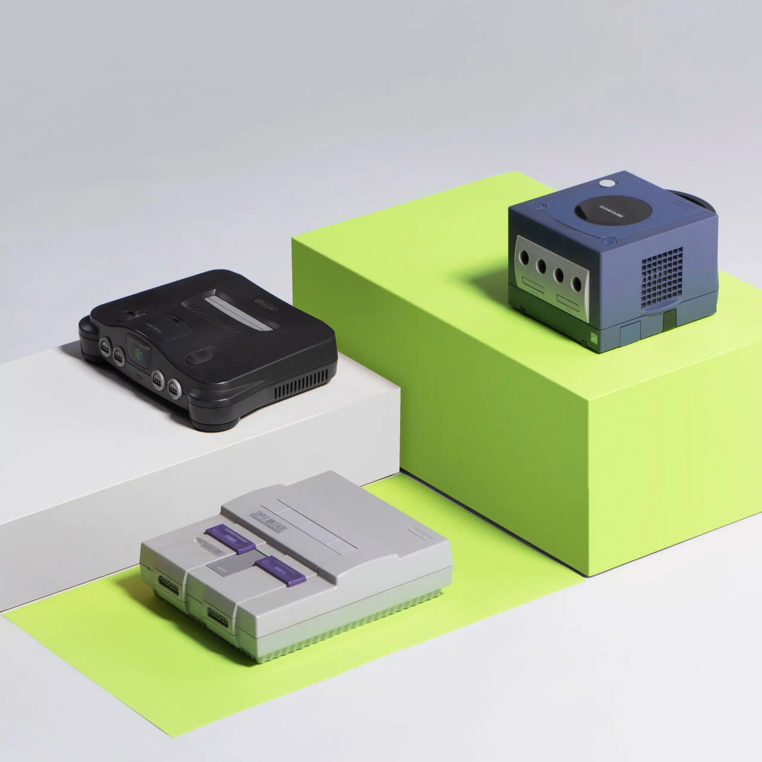 Heart Piece Plus 14 Three various gaming consoles on display