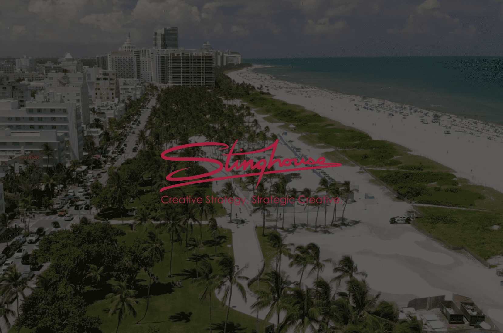 Red Stinghouse Creative Strategy Strategic Creative logo with a background overhead view of a beachfront with beach on right and buildings nearby on left. In the middle are many trees and palm trees.