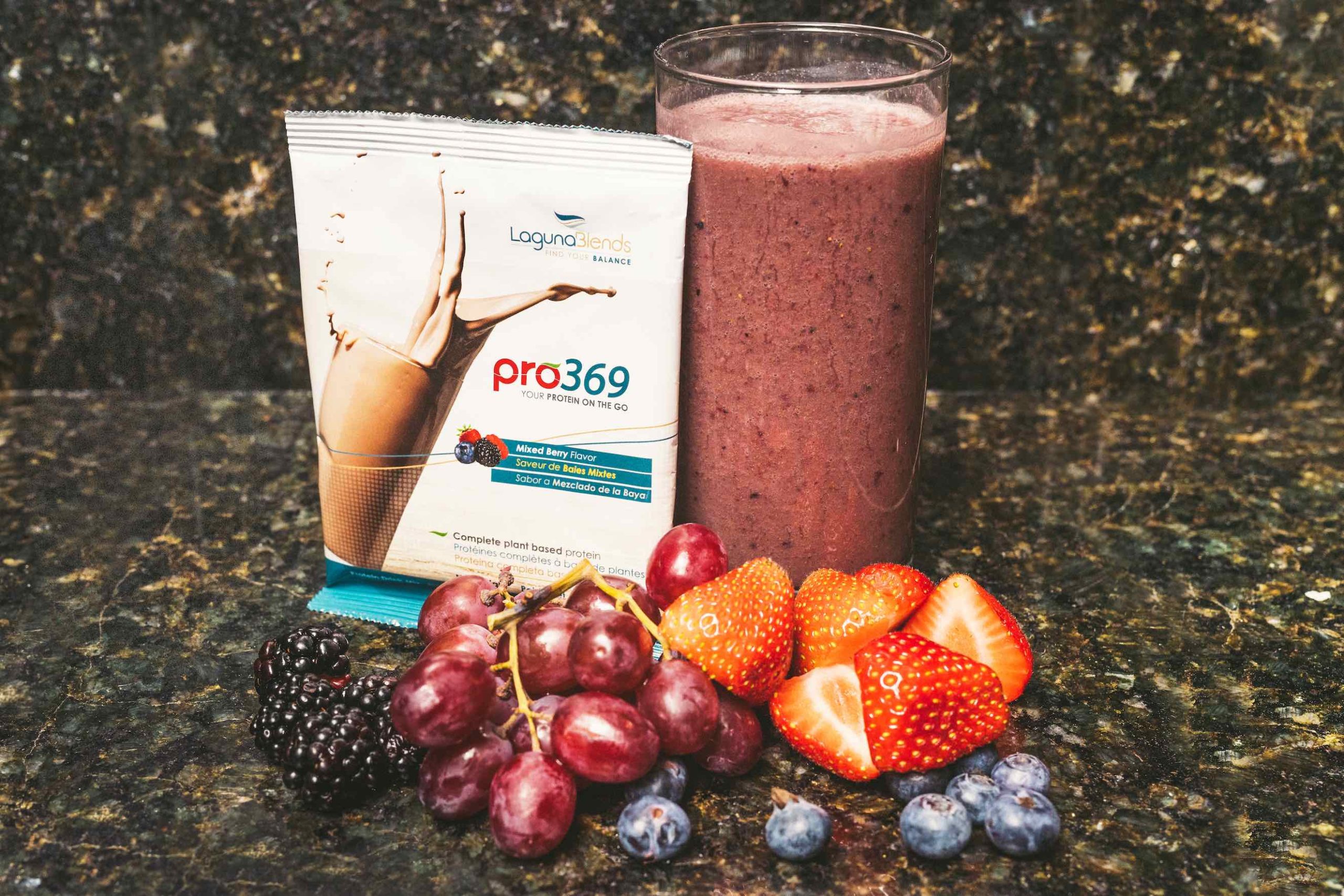 CBD Product Photography Display of pro369 protein pack with glass of smoothie and fruit