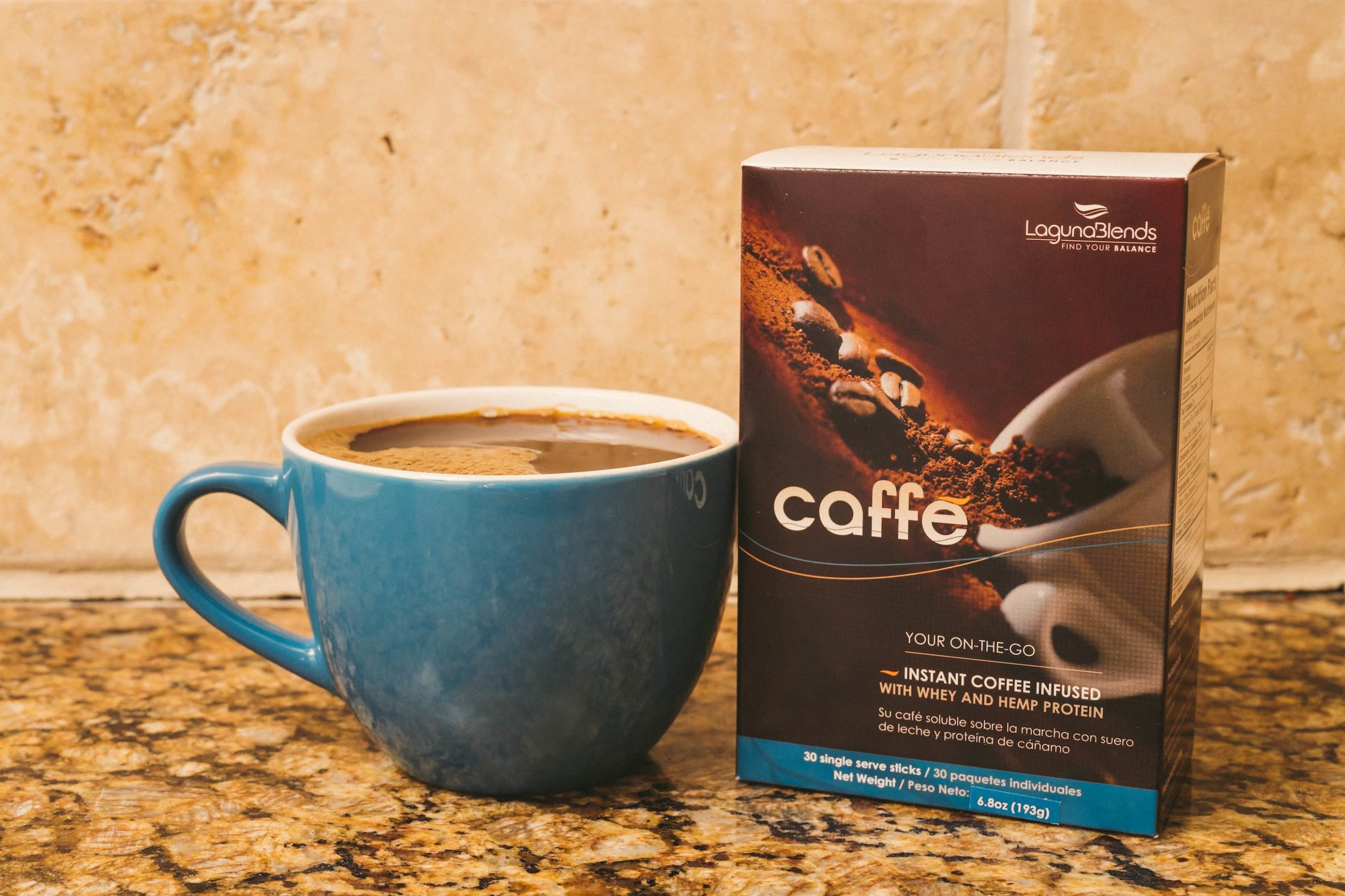 CBD Product Photography Laguna Blends instant coffee box next to light blue cup of coffee on display
