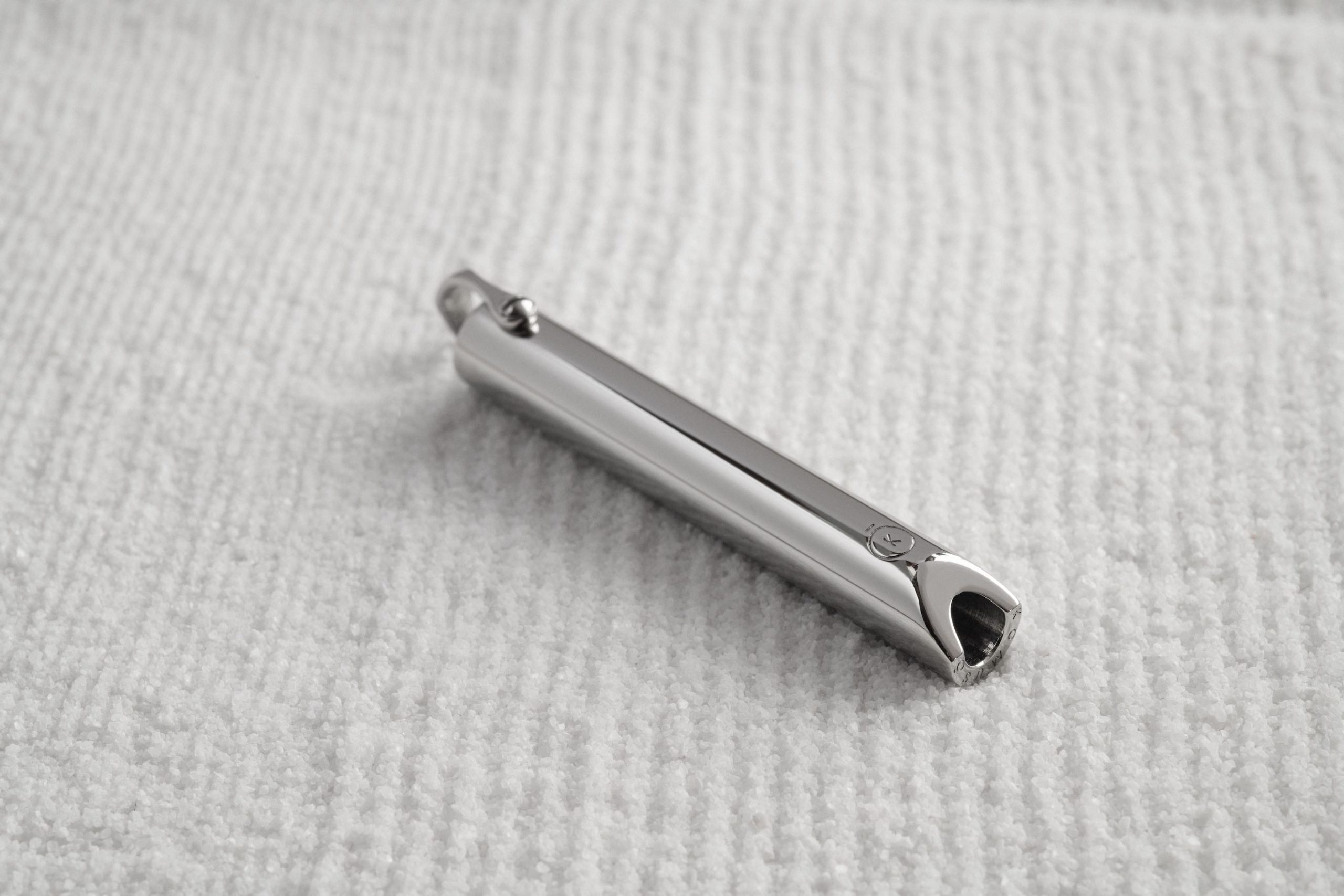 Komuso Design Photography Closeup of silver colored whistle