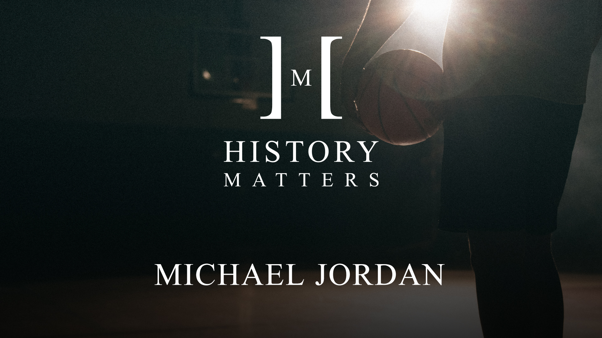 White History Matters Michael Jordan logo by Charlie Villanueva with closeup of a man holding a basketball on a basketball court