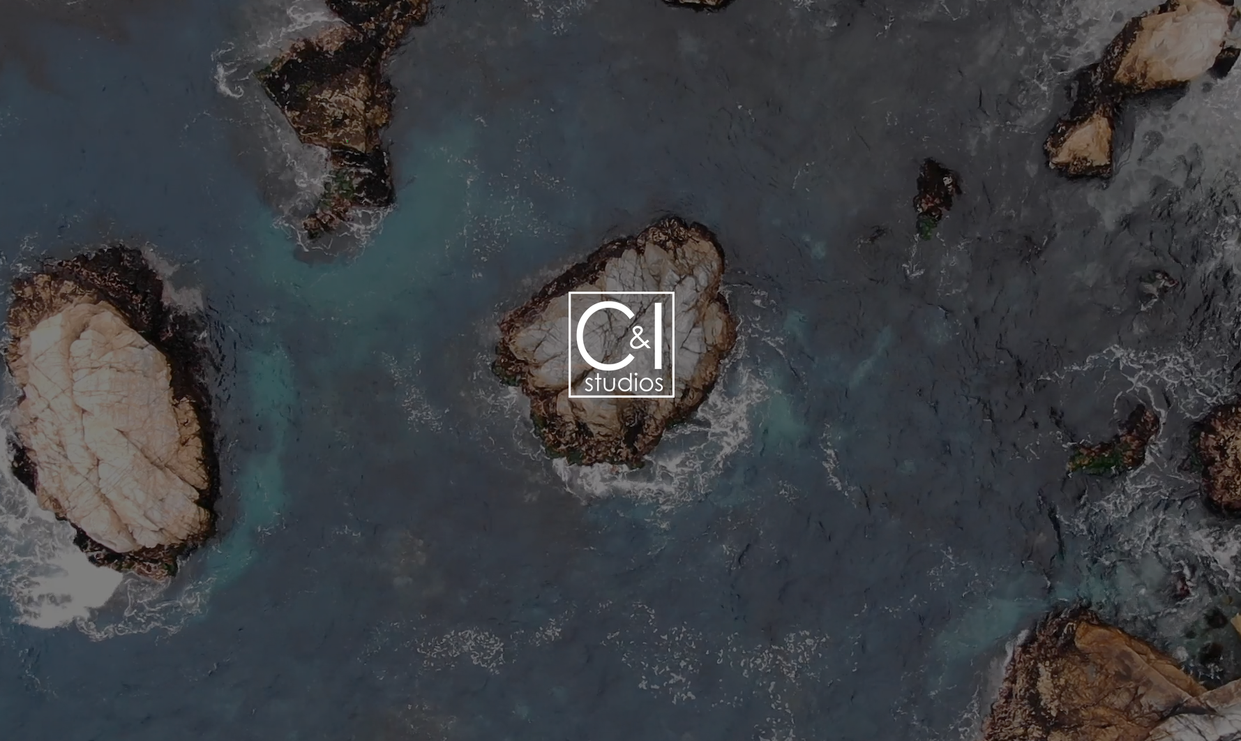 CI Reels Featured Image Aerial view of rocks in an ocean