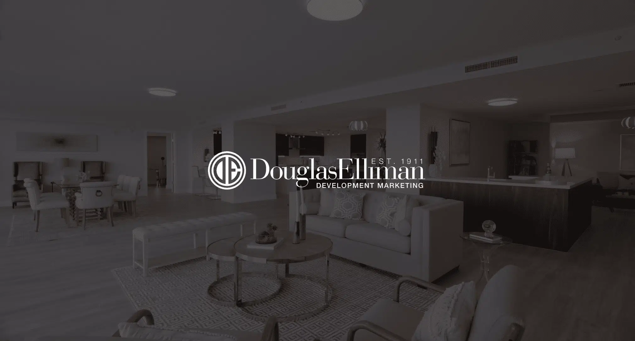 IU C&I Studios Page White Douglas Elliman Development Marketing logo Featured Image with black and white background of furniture in a living room and dining room of a house
