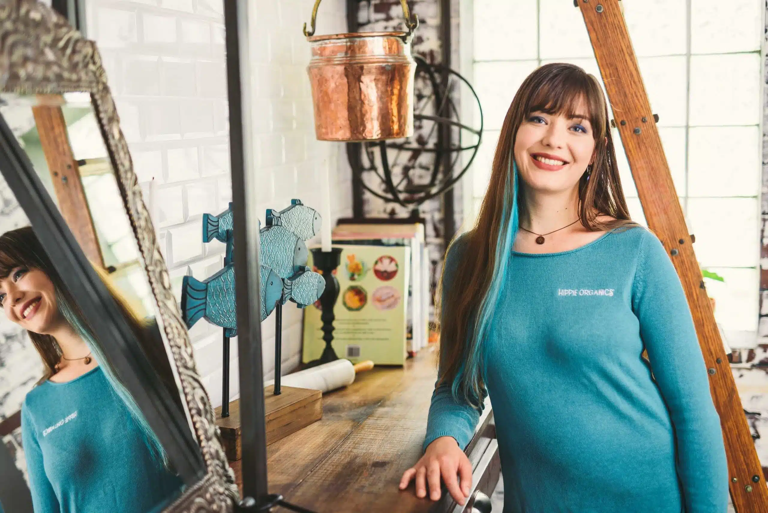 Hippie Organics by Alpine Fresh 16 Hippee Organics female employee wearing a turquoise sweater smiling and posing for the camera
