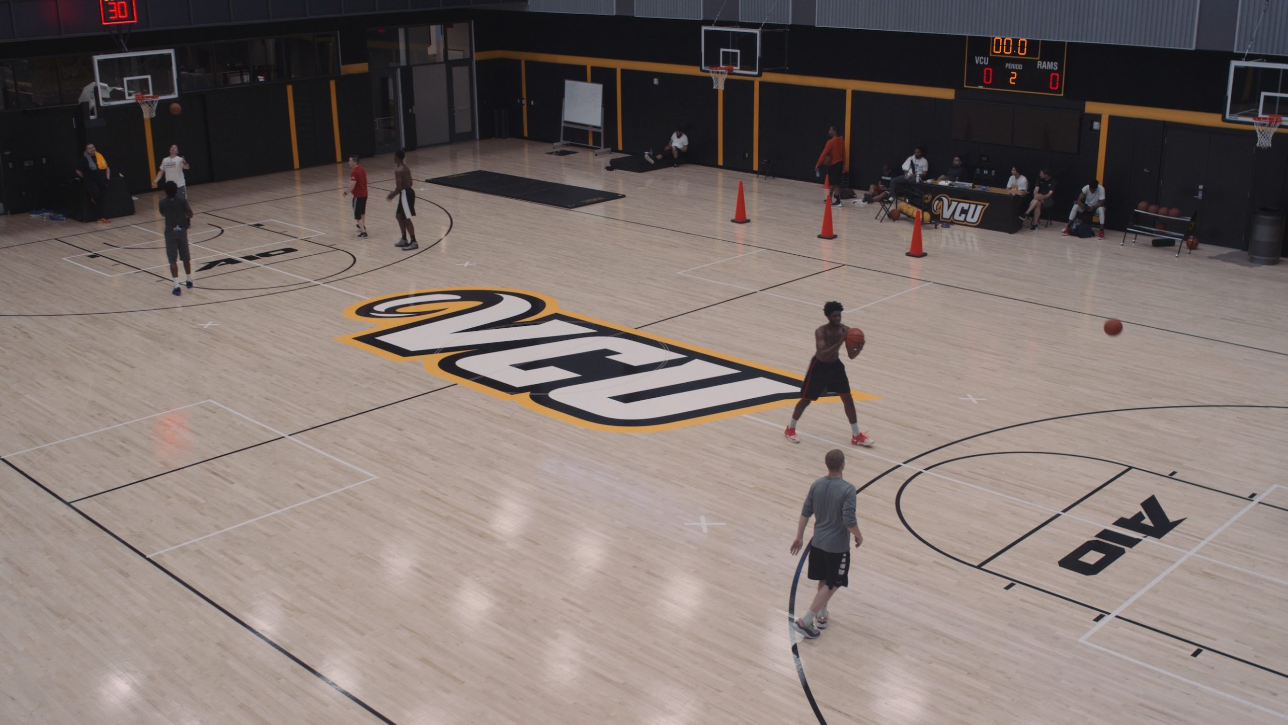 Sportsblog, a documentary mini series Aerial view of a basketball court with players doing practice drills