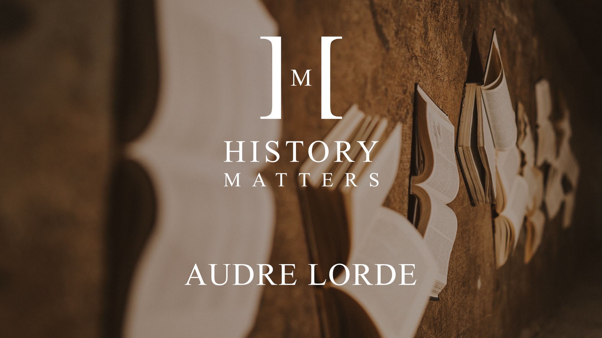 White History Matters Audre Lorde logo with background of opened books