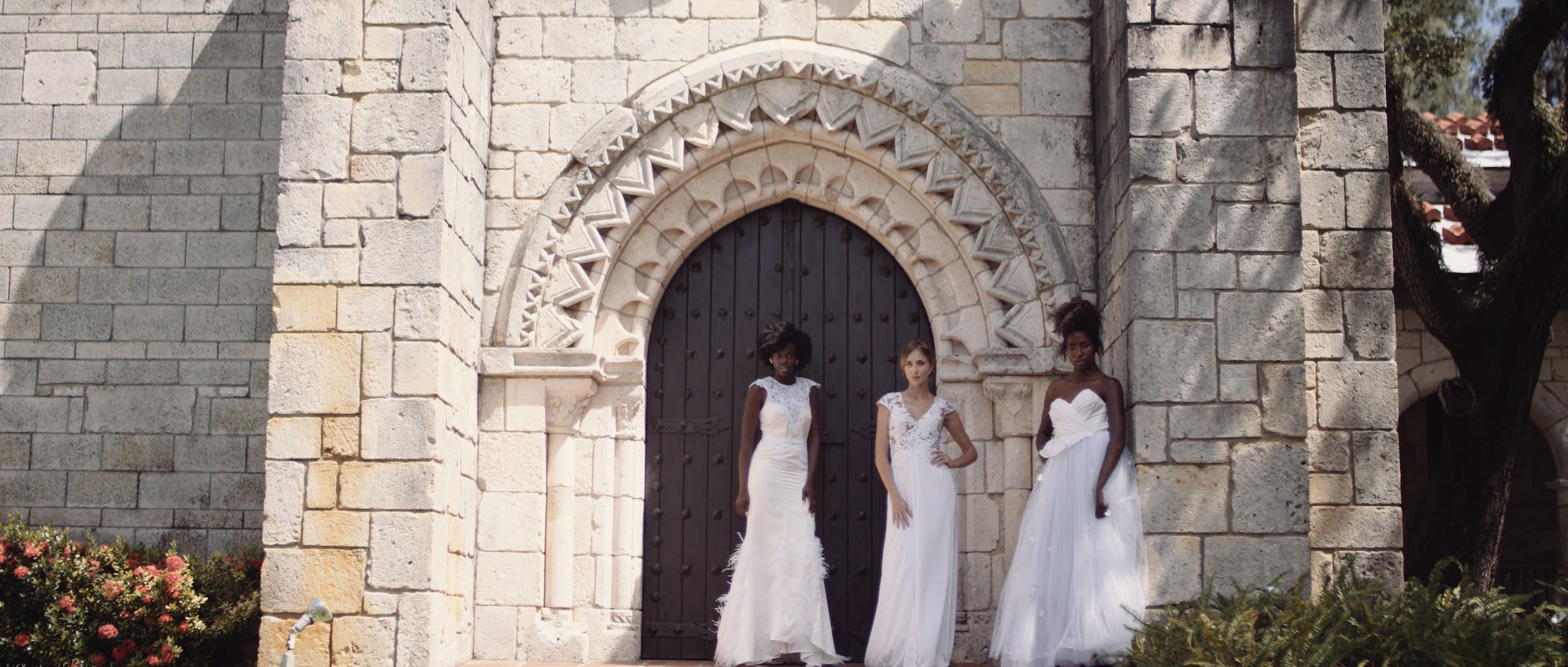 Dailies 0059 Delilah Castro Wedding Dresses Three women in wedding dresses posing in front of church door