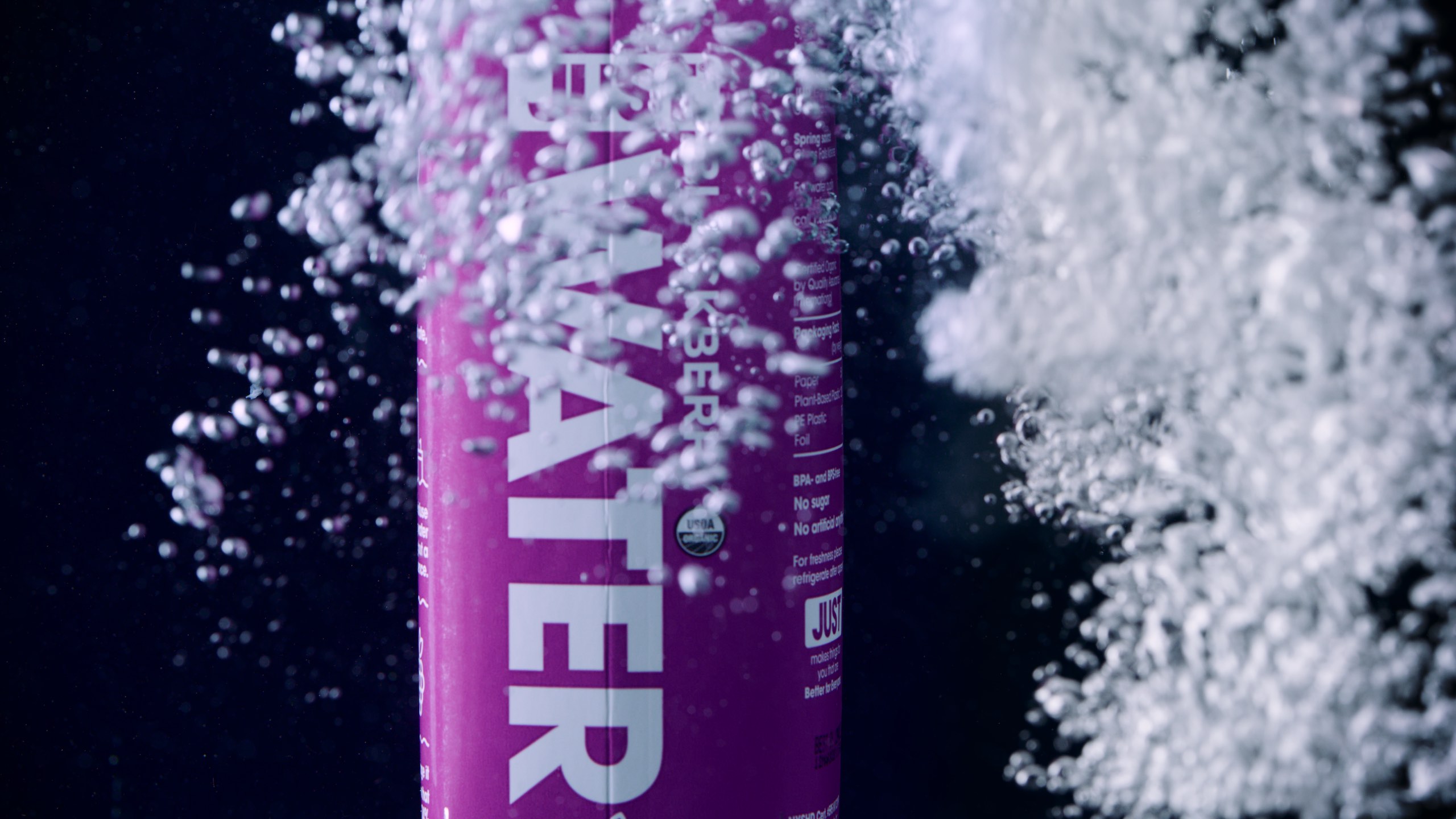 IU C&I Studios Portfolio Just water video ad Purple container of spring water on display with bubbles