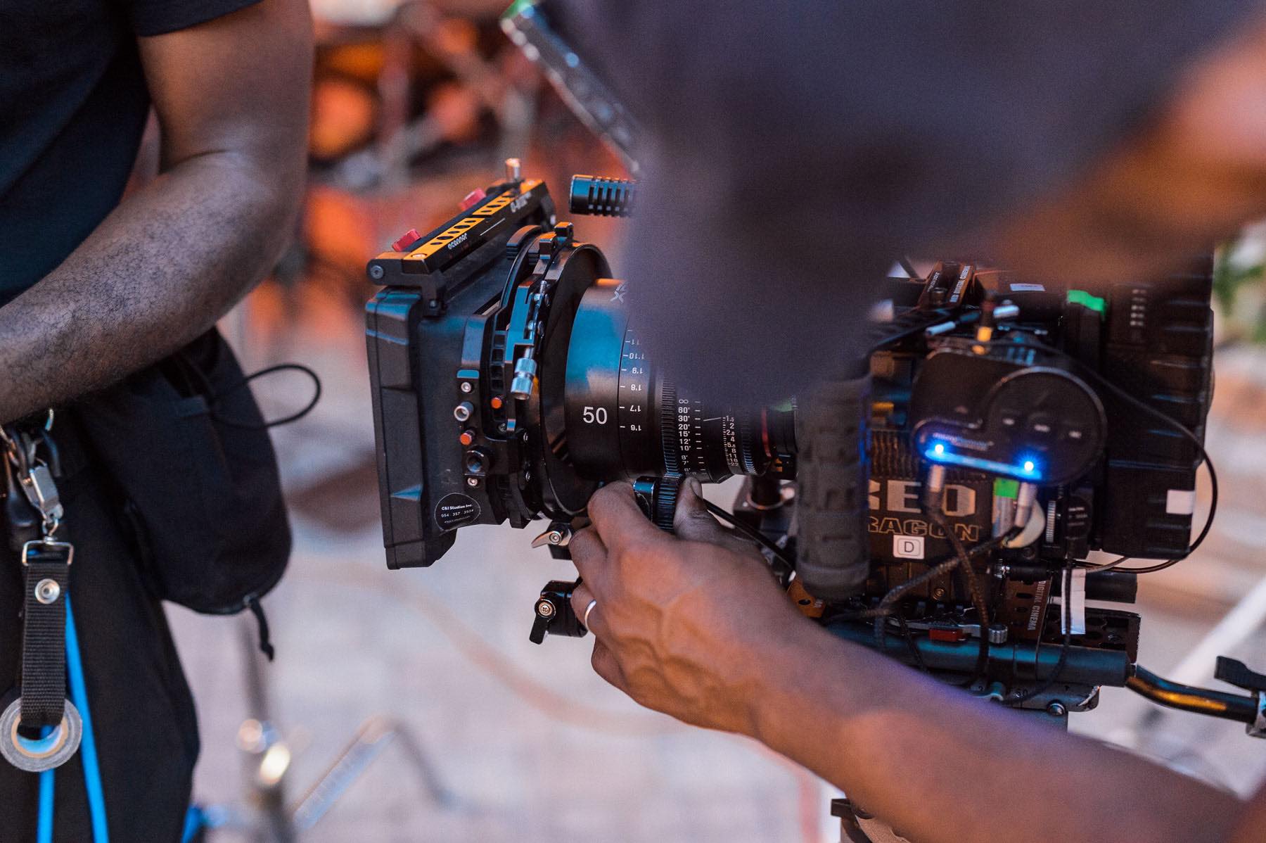 Love and War Feature film mastering and delivery services by C&I Studios Closeup of video camera with crew members