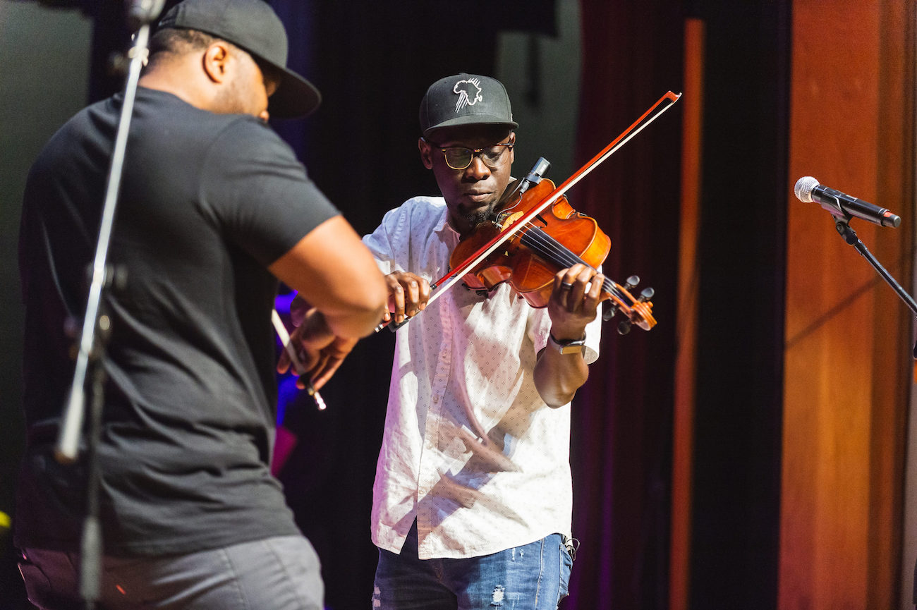 Broadcast Beat C&I Studios Relies on DaVinci Resolve 16 Studio’s Cut Page for Social Media Deliverables Two men playing violin on a stage