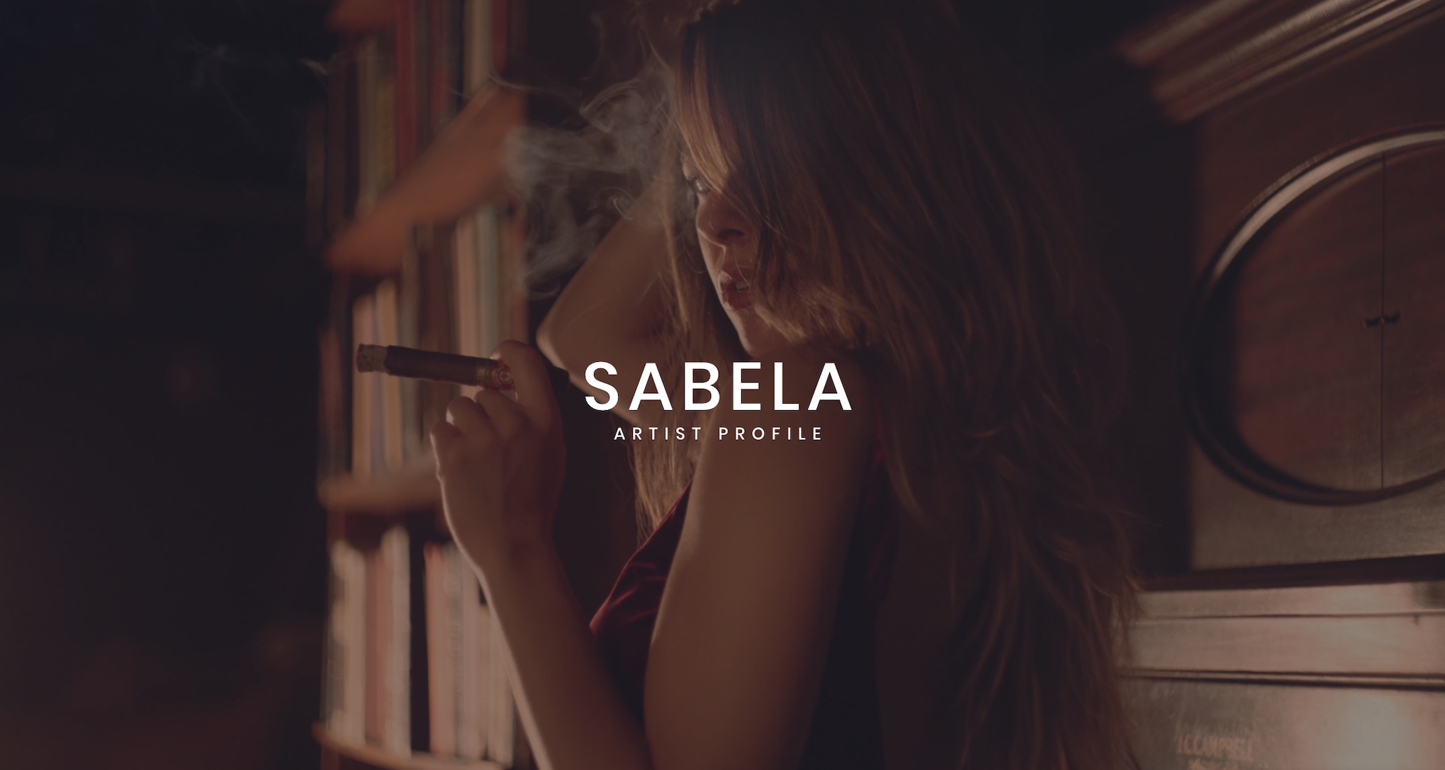 Keyword: Artist Management Services .Sabela Artist Management Services White Sabela Artist Profile logo on background of side profile of woman smoking a cigar posing for camera