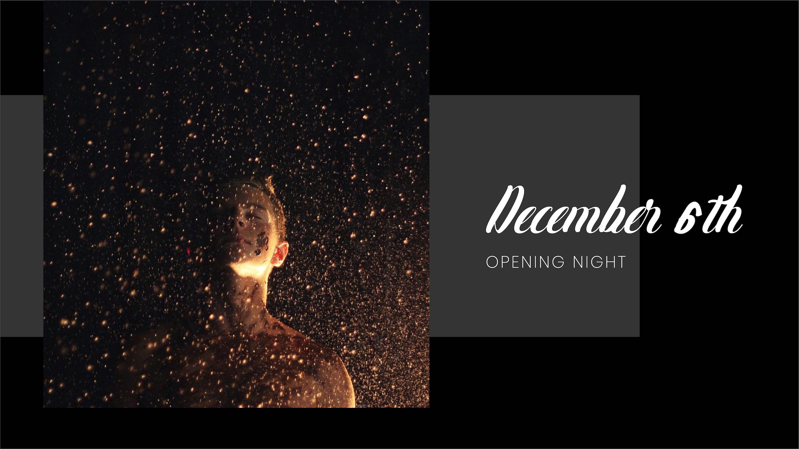 December sixth Opening Night with young tattooed man in the rain looking up with eyes closed