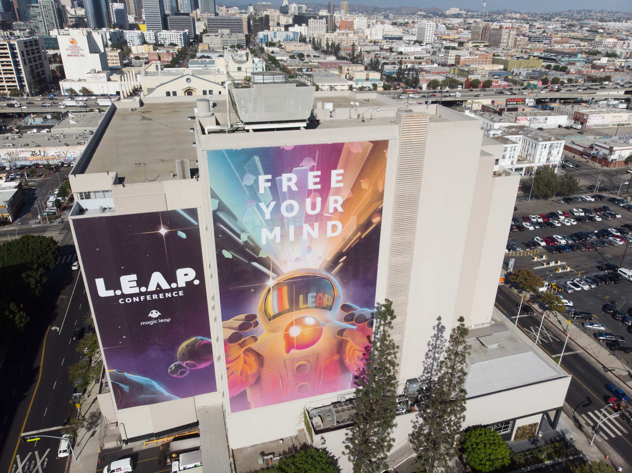 LEAP Conference Magic Leap and Free Your Mind banners on display on side of a building in city