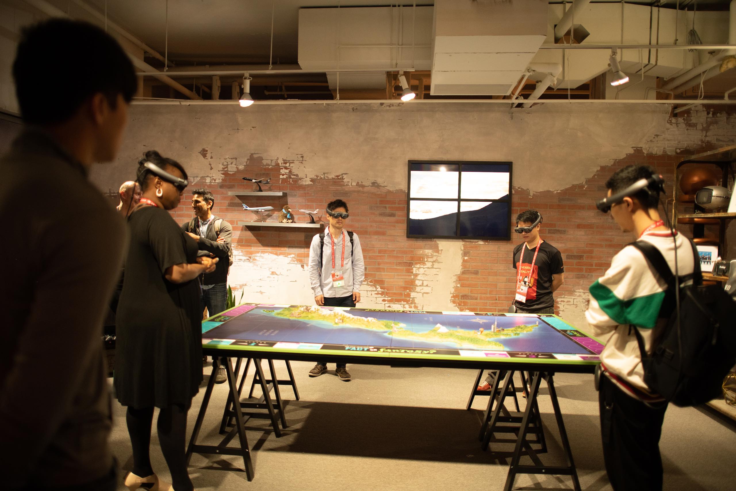 People wearing Lightwear equipment standing around a table with a map on it