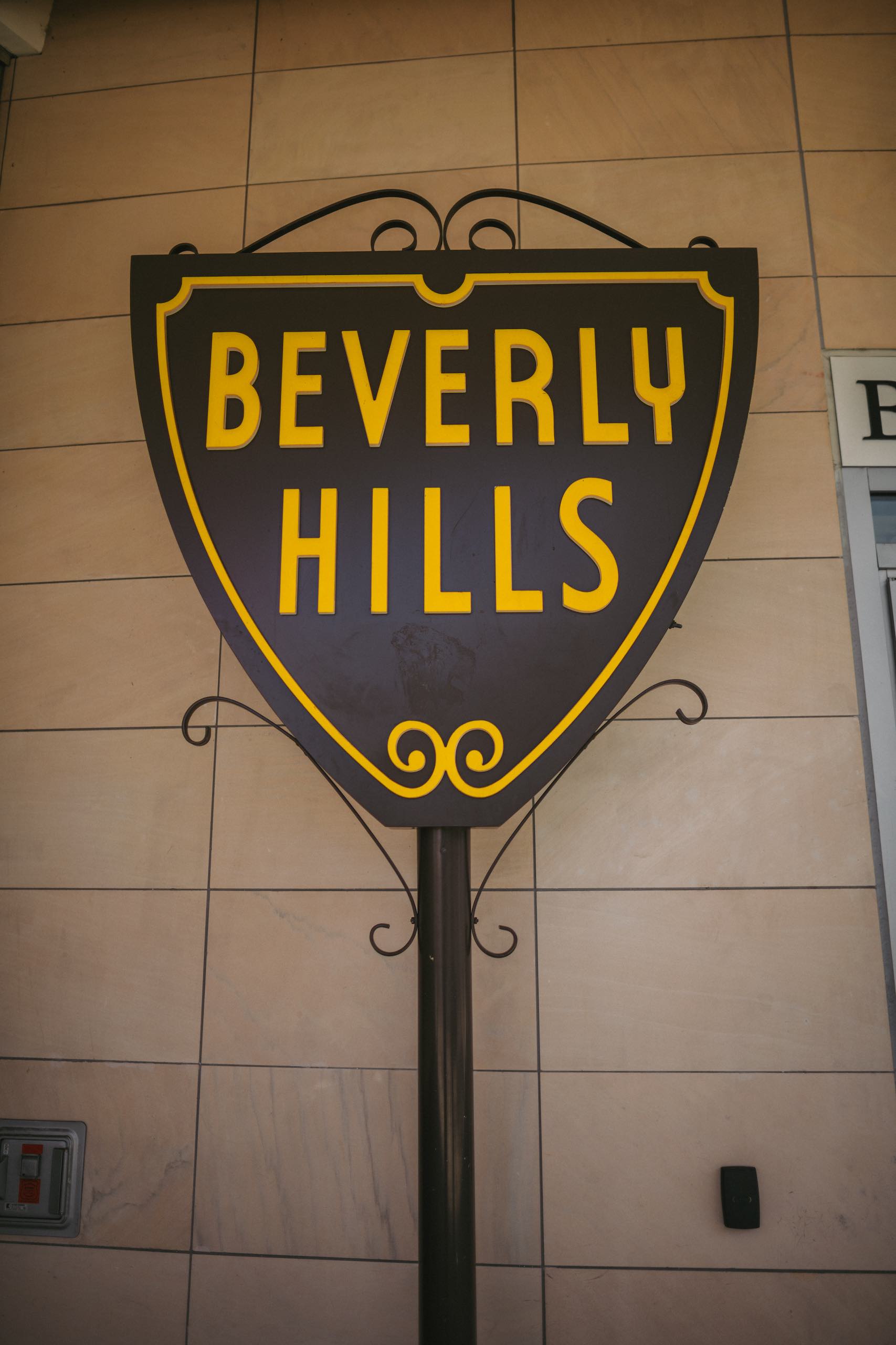 Peretti Italy Branding and Photography Closeup of Beverly Hill sign by a building