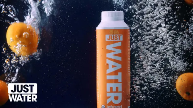 Corporate and Commercial Video Production 5 White Just Water video logo on a background showing an orange drink carton underwater with tangerines and bubbles