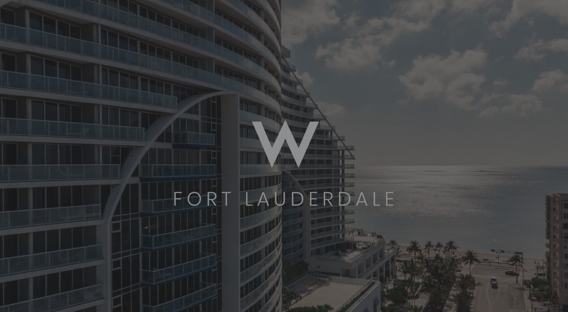 White West Fort Lauderdale Logo Social Media Marketing with dimmed background showing an apartment by a beach