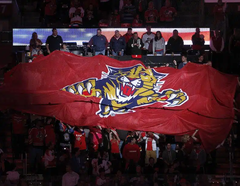 The Florida Panthers 27 Flag being held by fans in a crowd