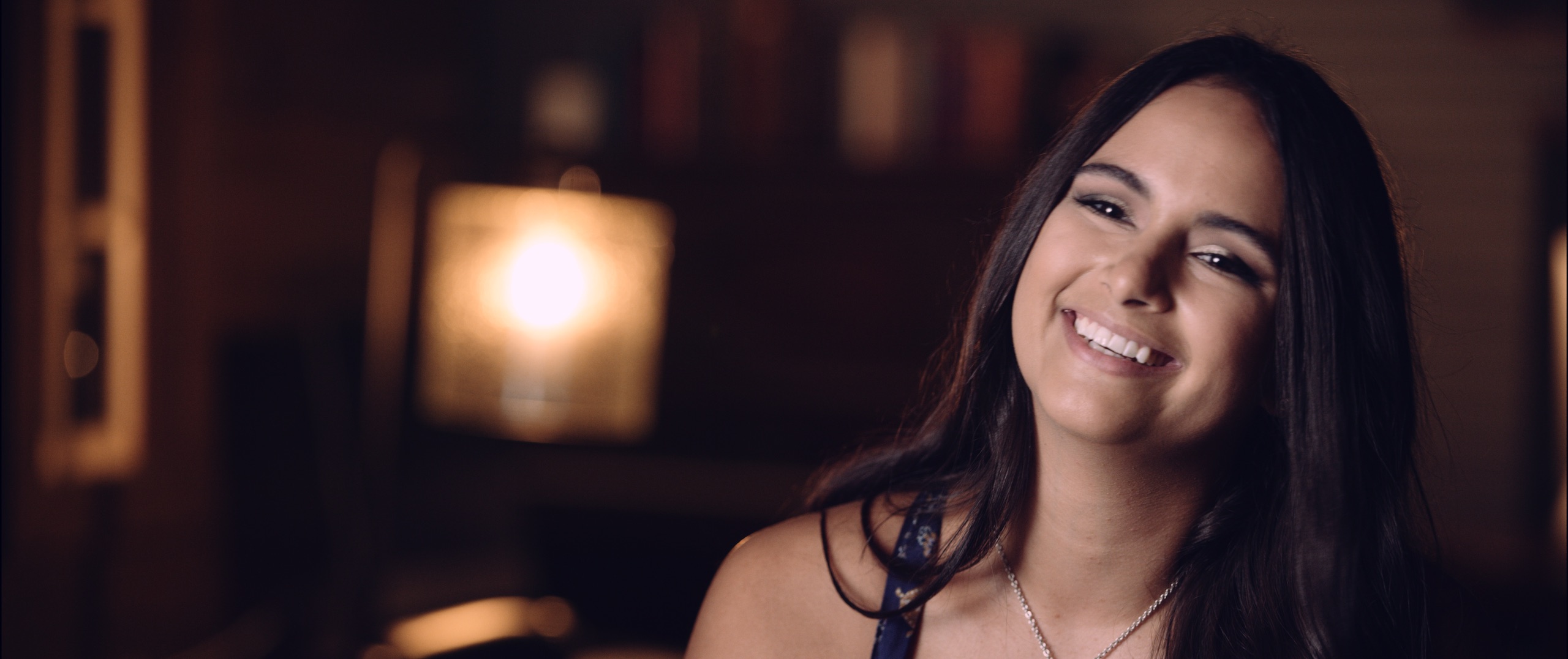 The Dailies Episode 202 BTS Footage with closeup headshot of Mercedes Gutierrez smiling for the camera