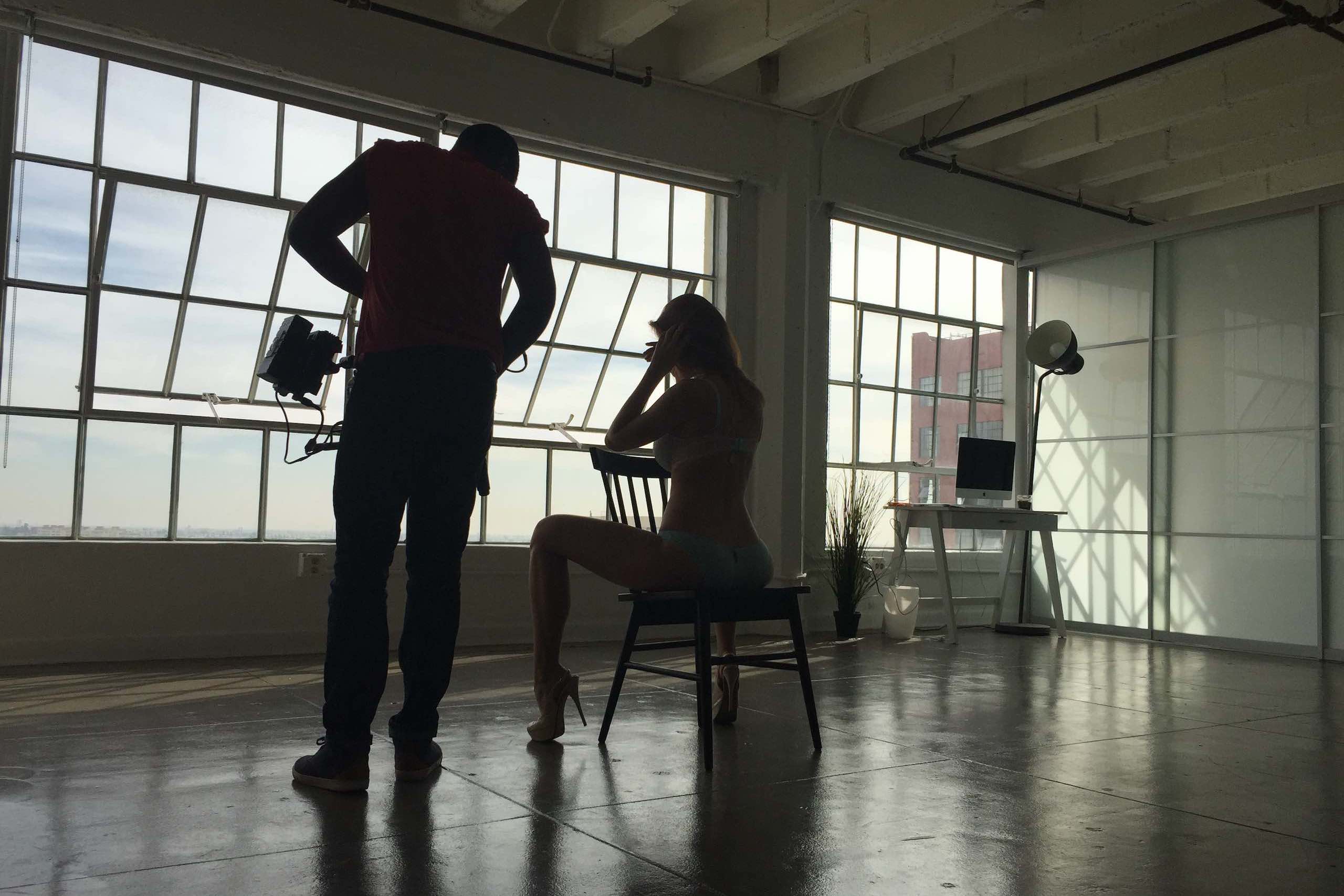 Production Resources Studio Loft LA with crew member filming a model sitting on a chair
