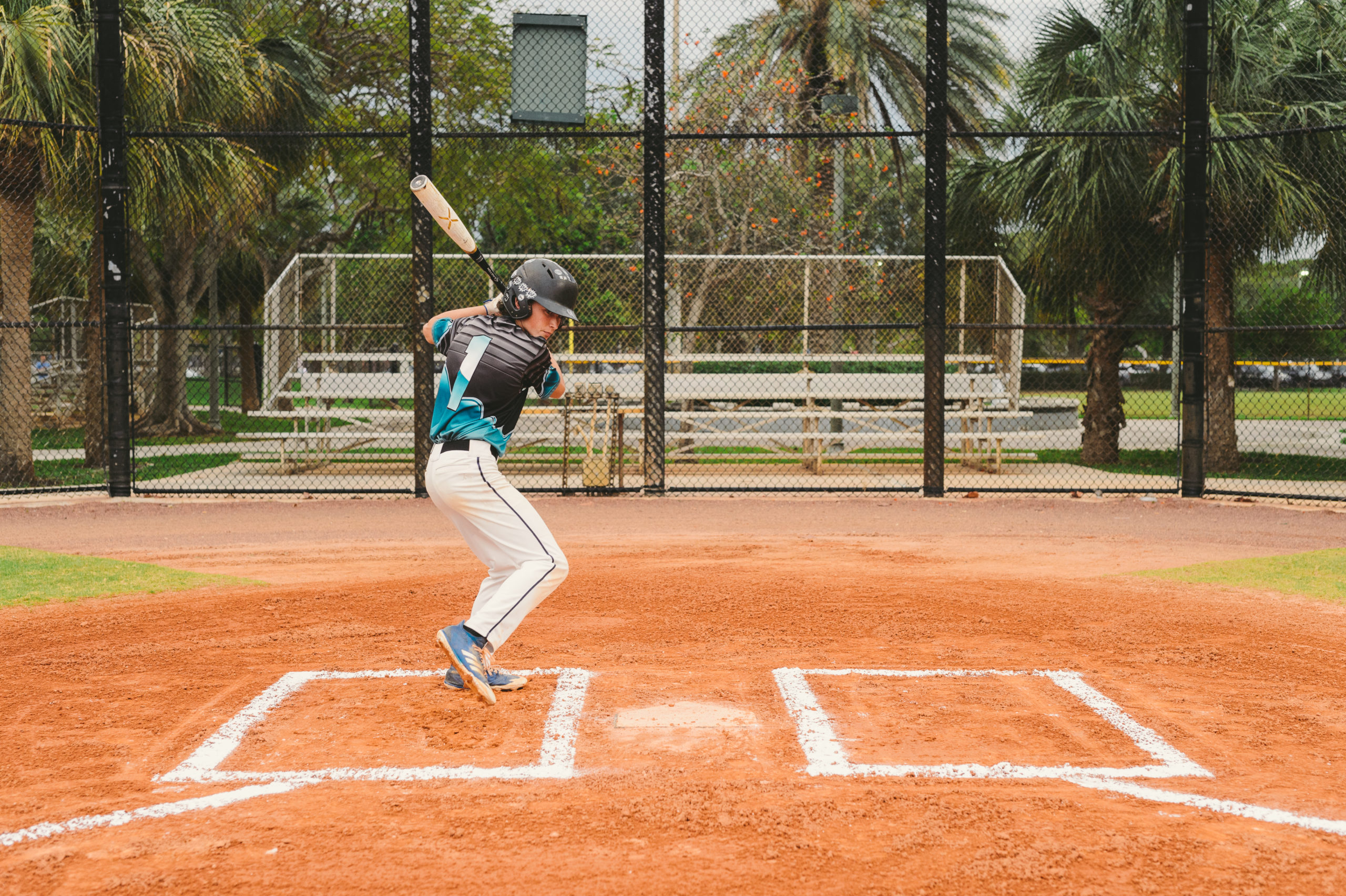 IU C&I Studios Portfolio Ball Cap Liner Young baseball player in a batting pose on a baseball field