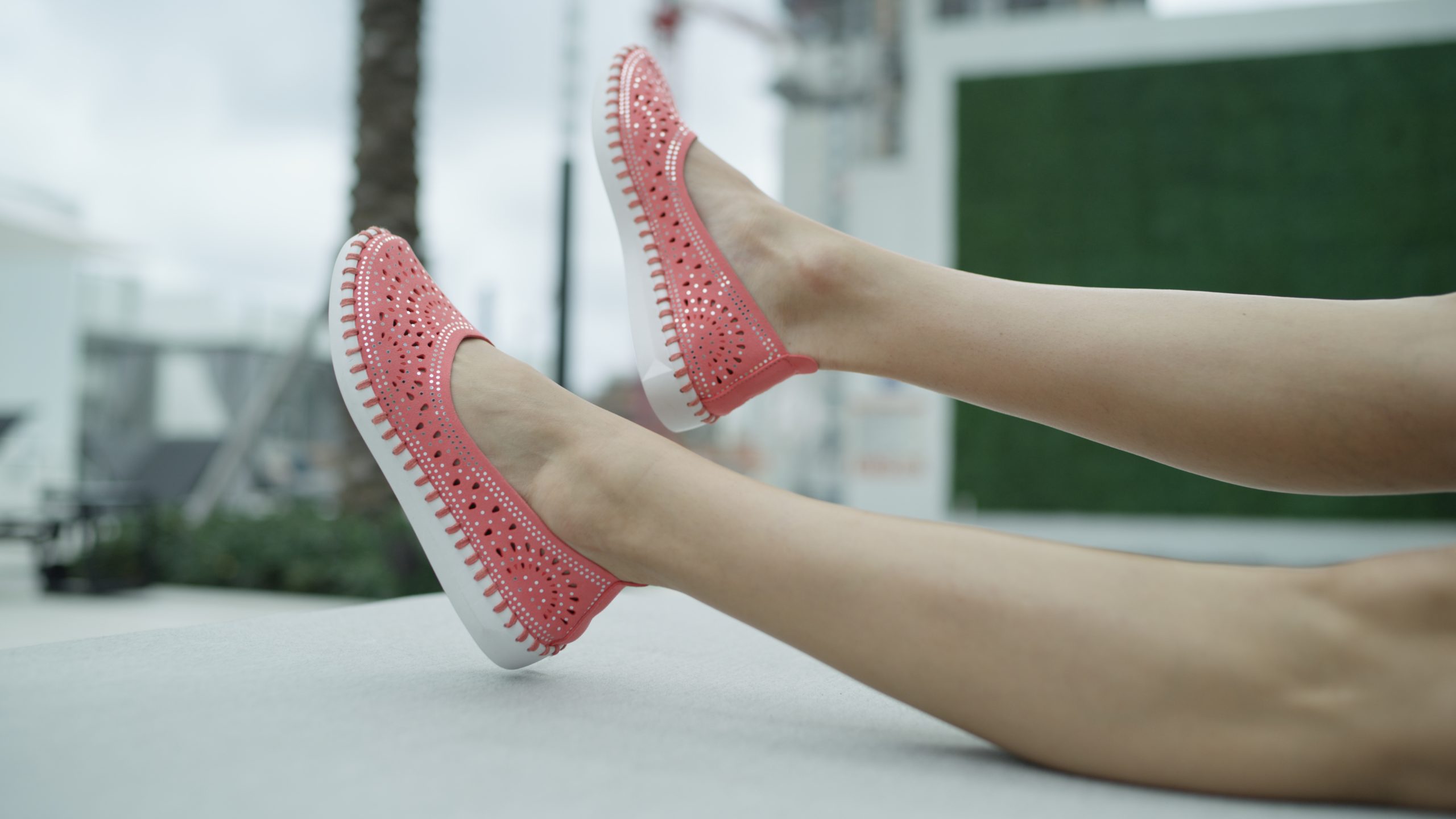 Spring StepPartizia Maiwenn Closeup of red shoes worn by a female model