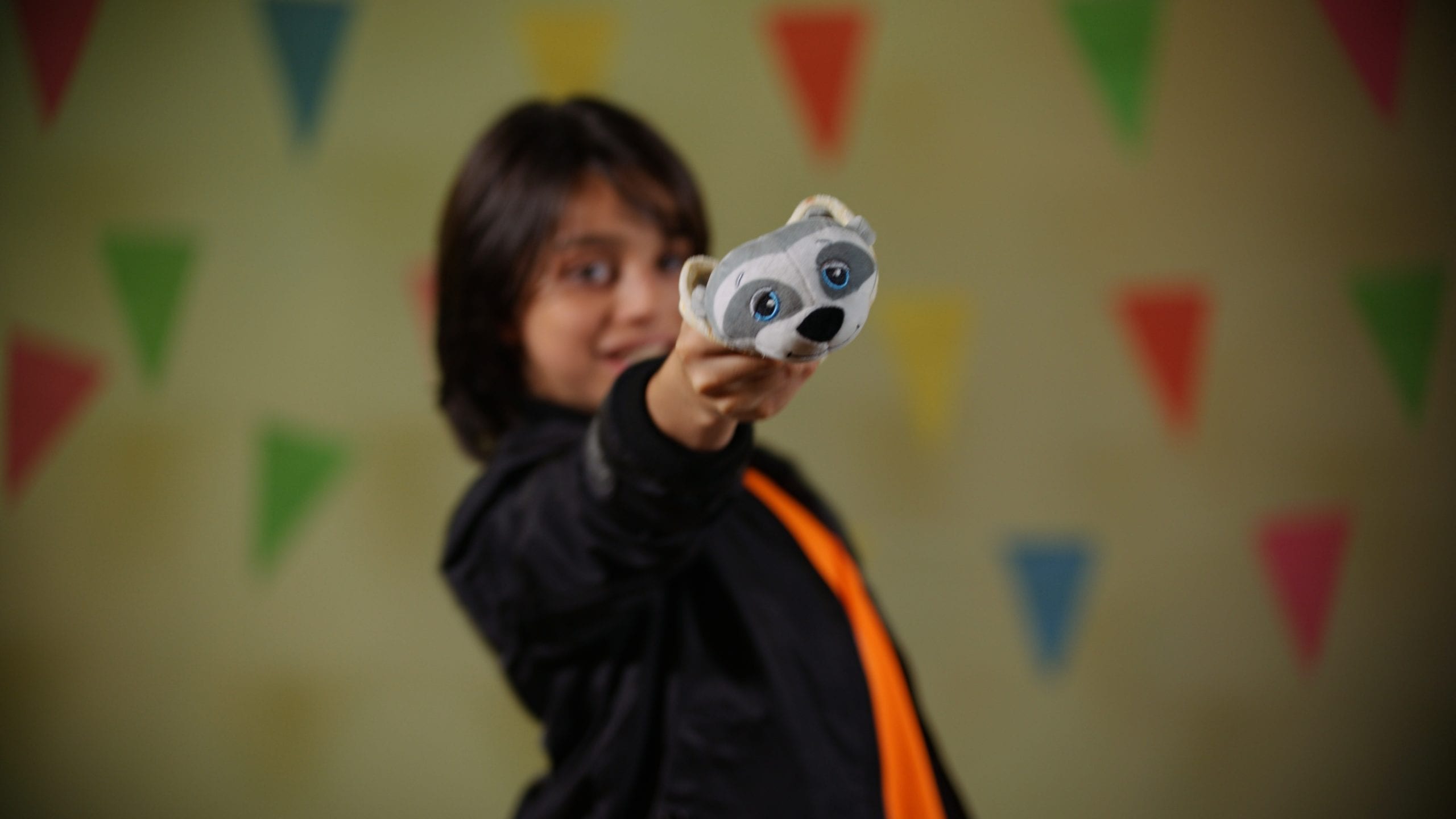 Closeup of stuffed animal being held by a child