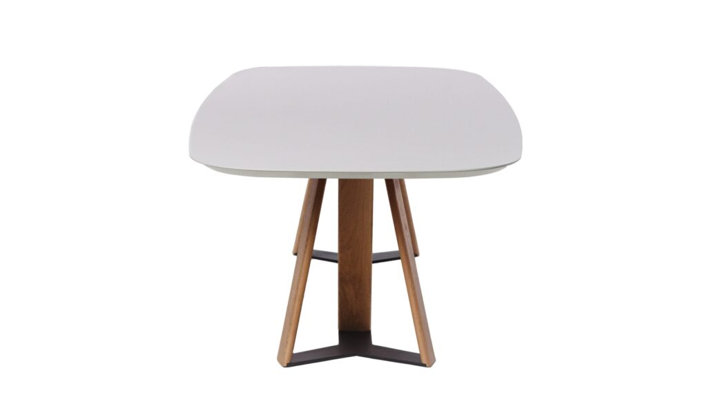 Small white table with wooden legs on display