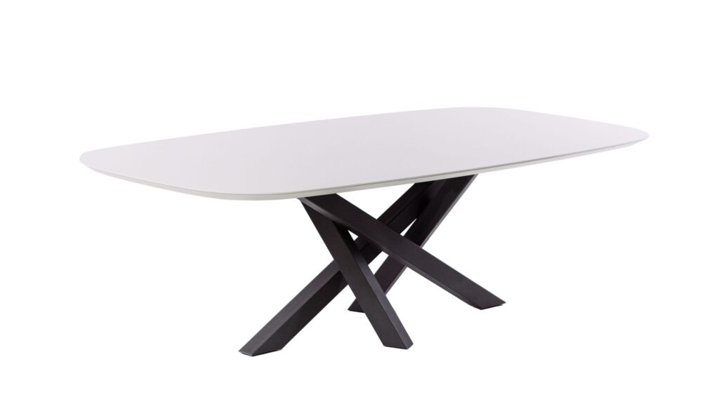 White oval table with black legs on display