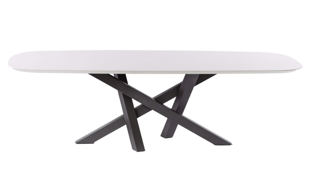 White oval table with black legs on display