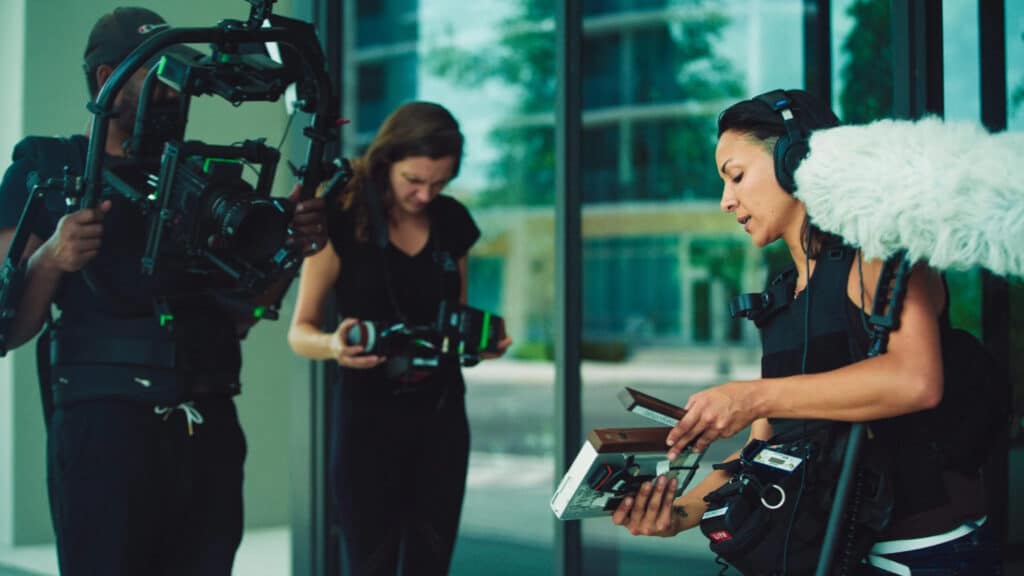 Ciara Santiago with Joshua and another crew member working with their respective video equipment