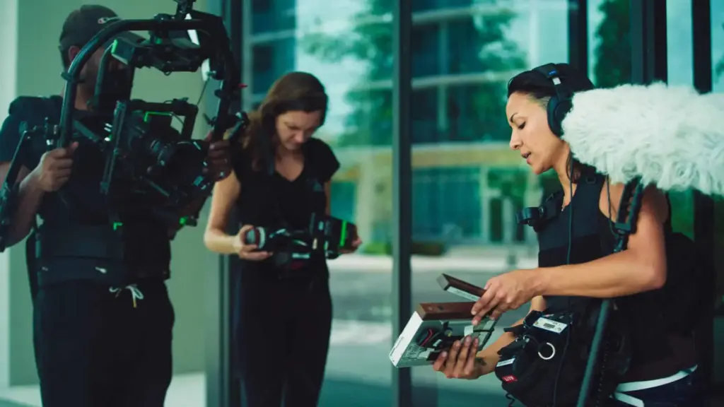 Staff 6 Ciara Santiago with Joshua and another crew member working with their respective video equipment