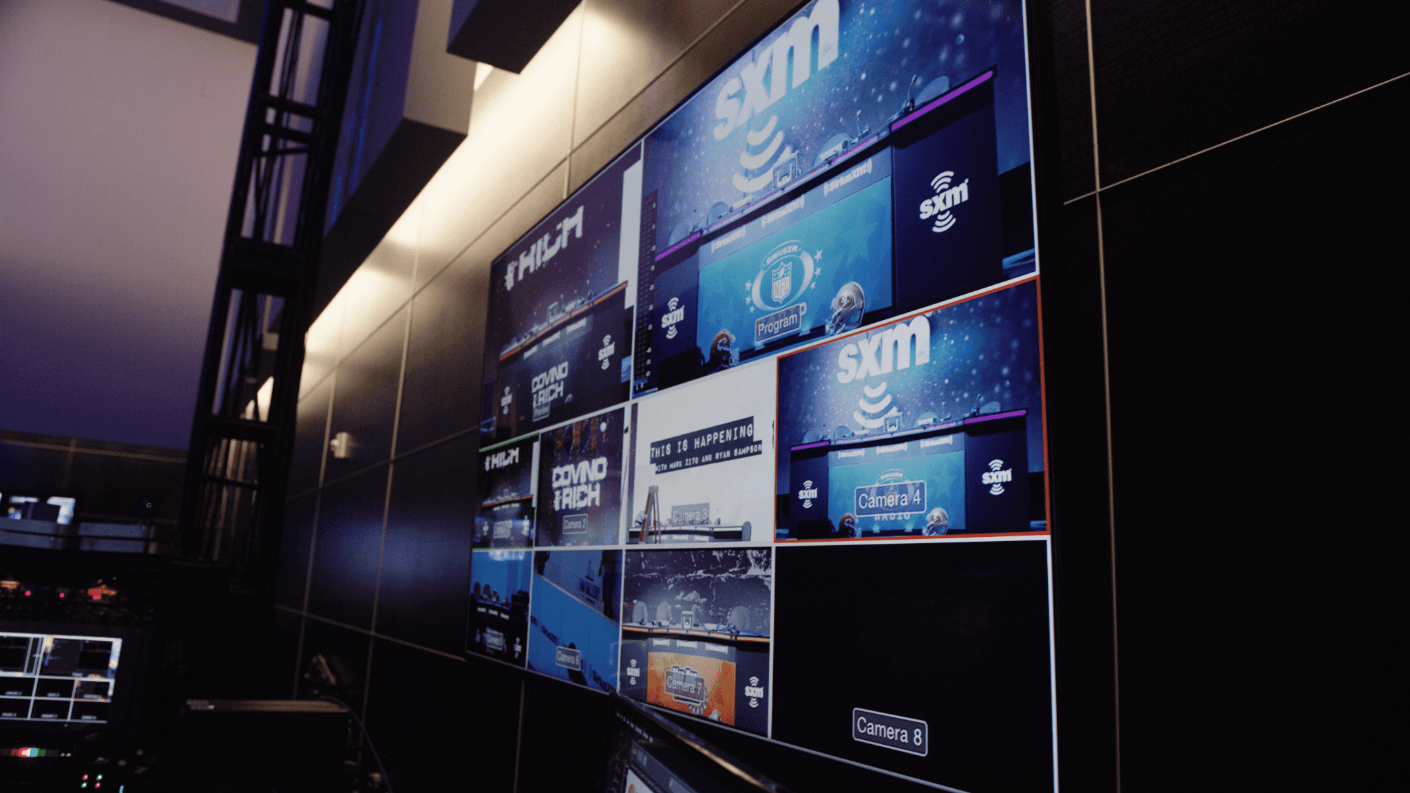 IU C&I Studios Page Professional Video Creation Service SiriusXM wall display of video bank