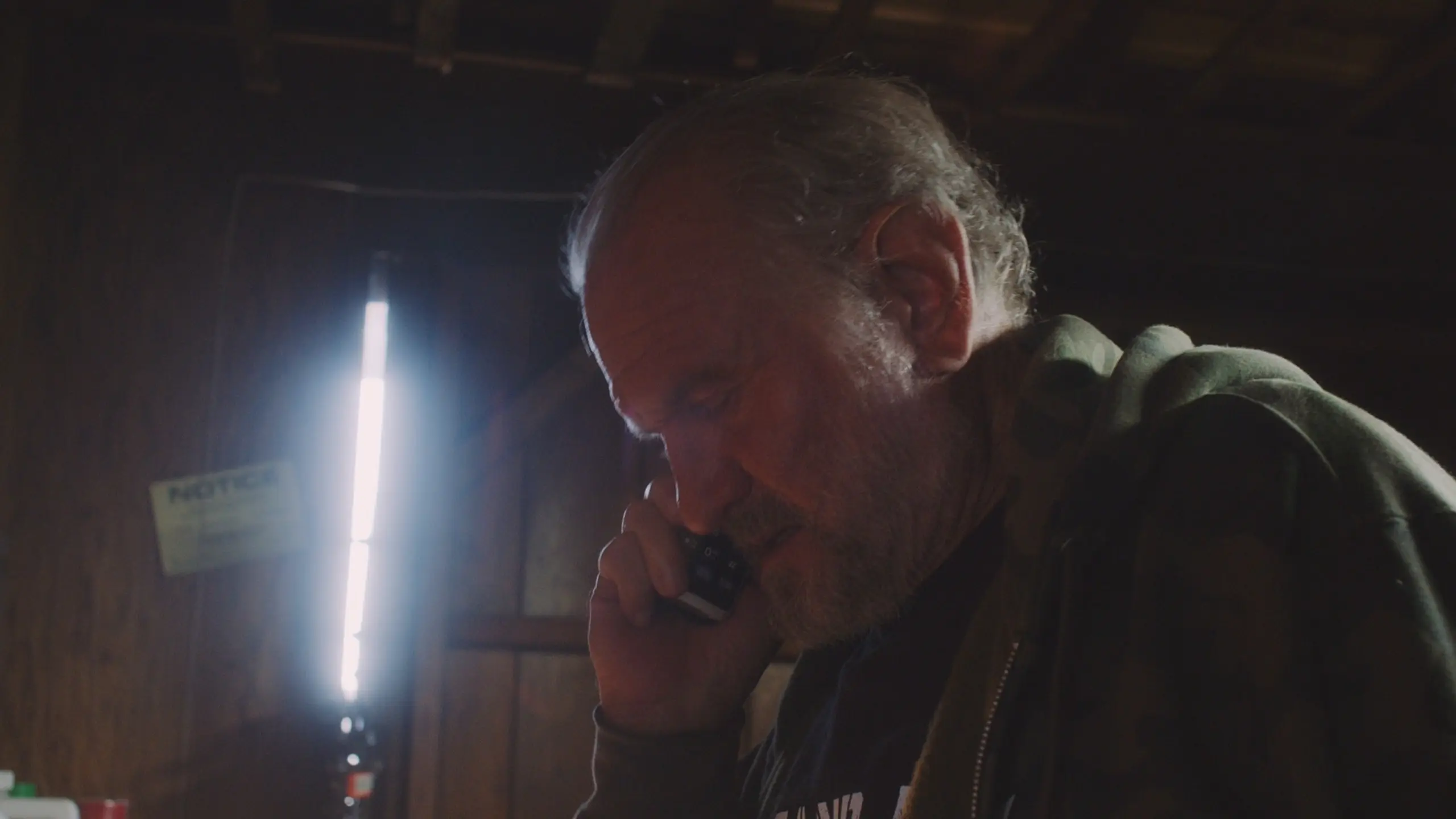 Bart McCarthy - Q Guy 12 Side profile headshot of Bart McCarthy looking down talking on a cell phone