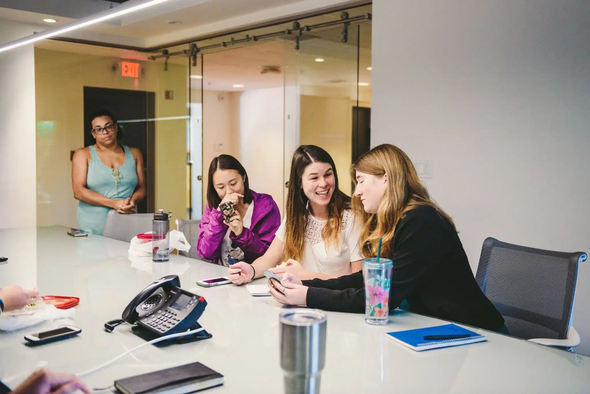 The importance of building a content strategy Three woman talking going over something while another woman looks on