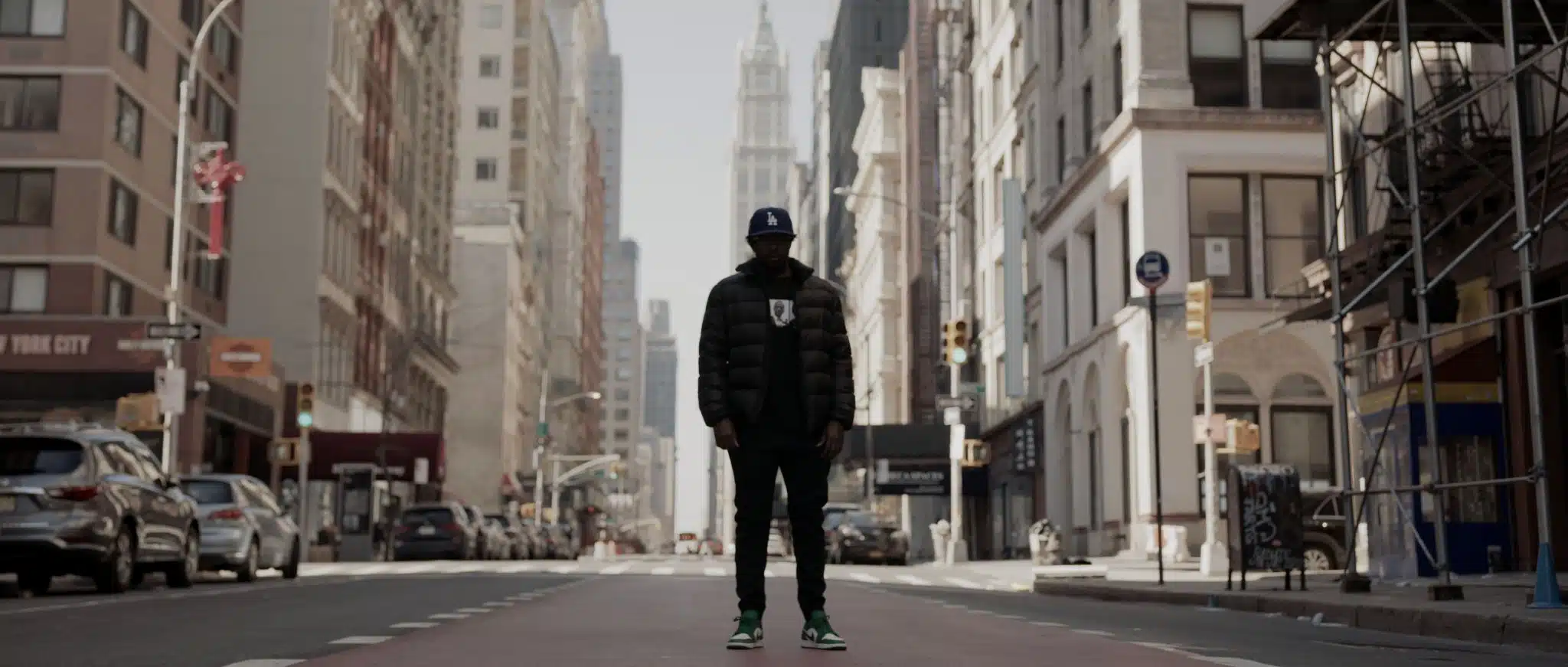 Top video trends to pay attention to in 2022 Man wearing baseball cap, coat and pants standing in the middle of street in the city