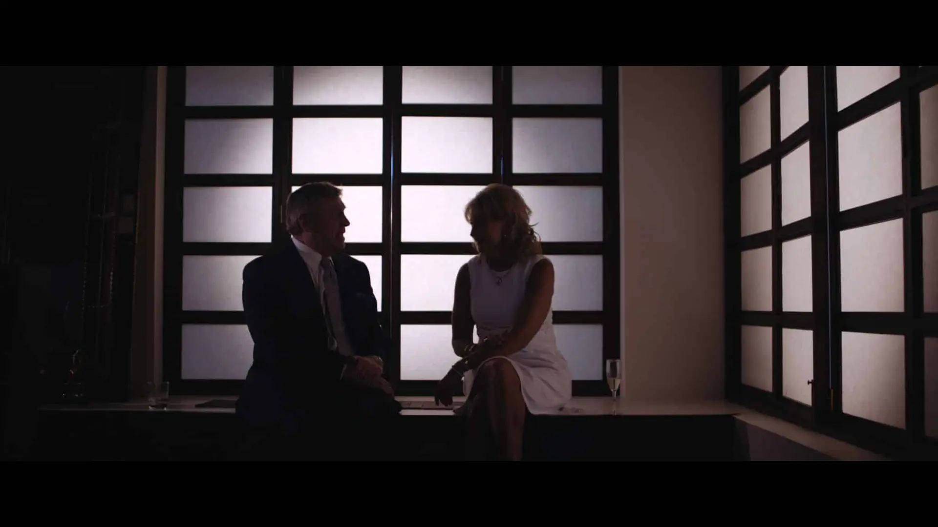 Man and woman talking in semidarkness