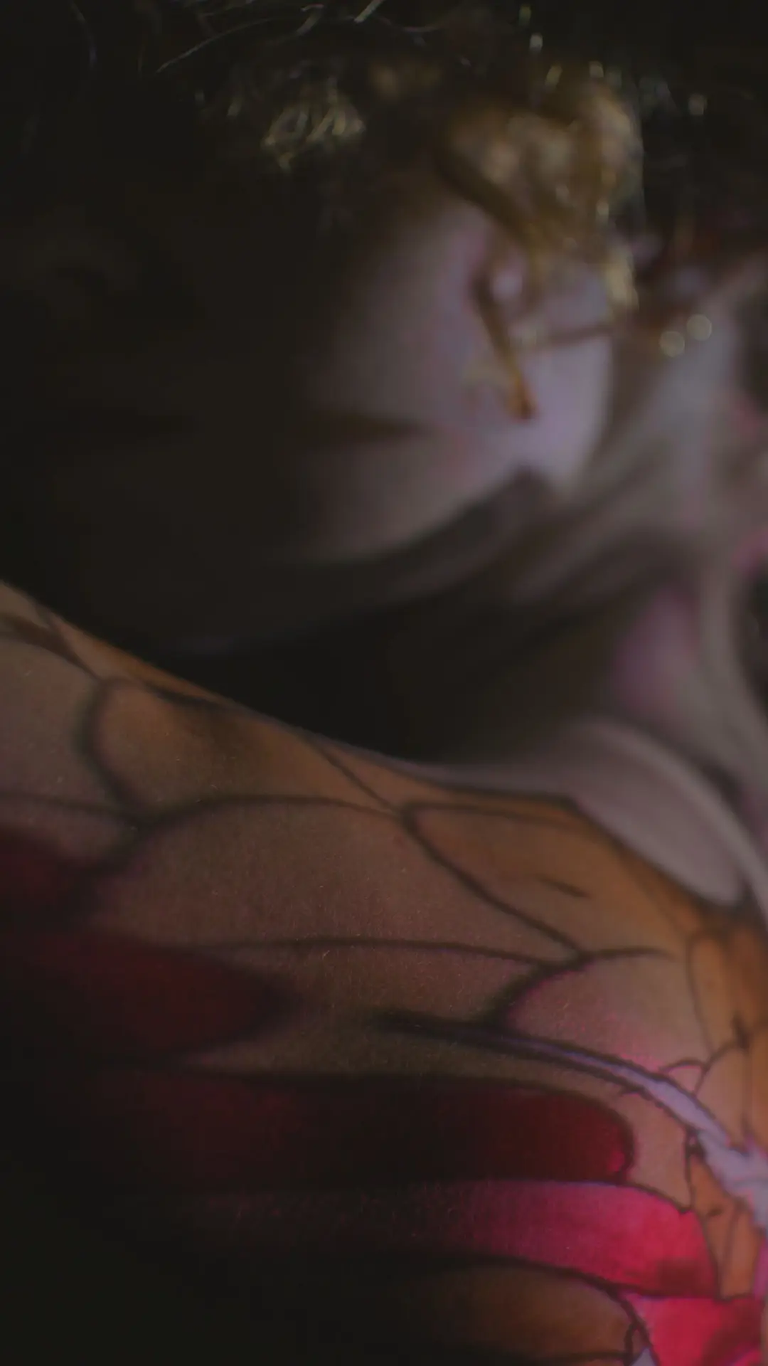 Side view of Tattoo Projection on a woman with long hair