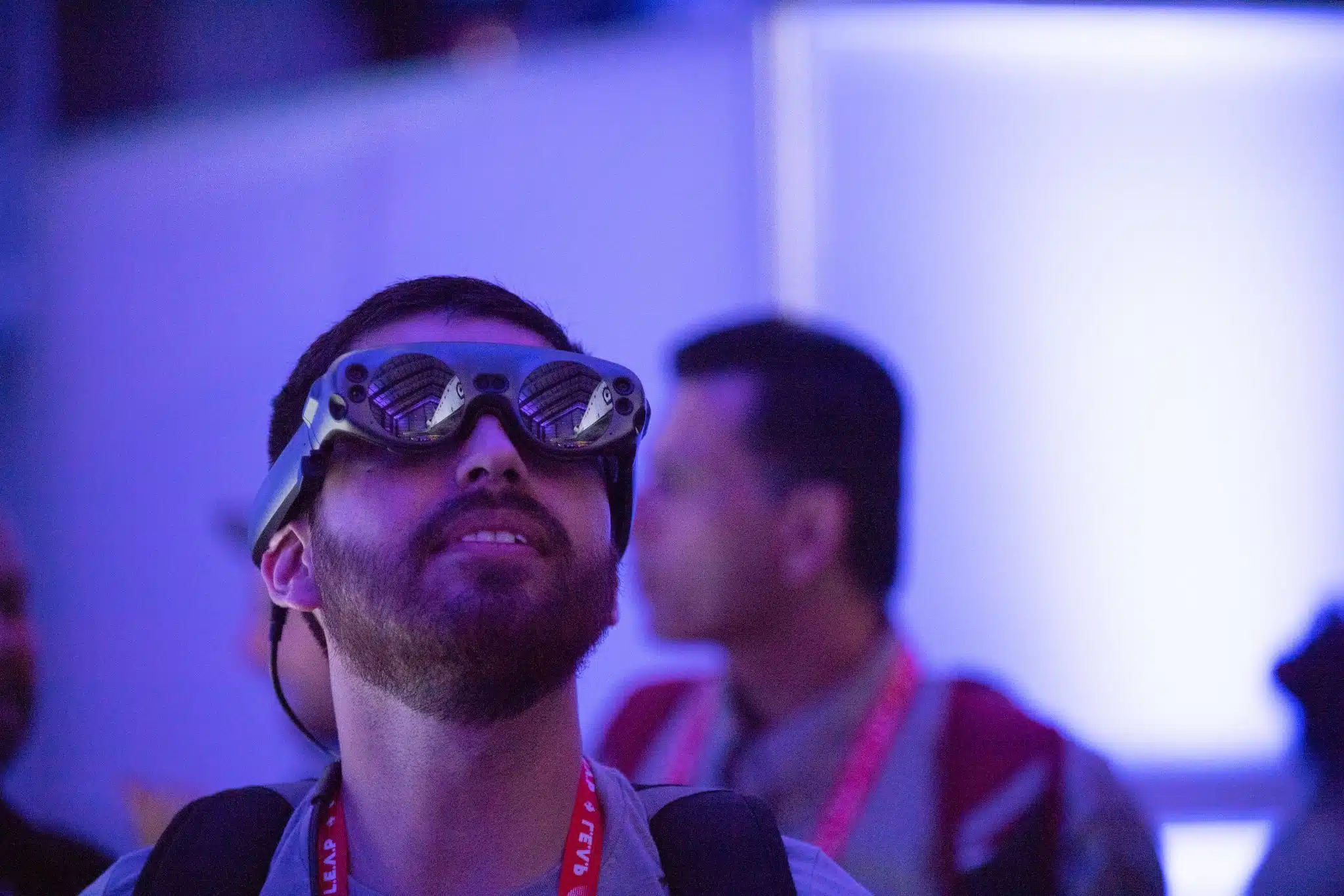 Headshot of man with beard wearing special glasses