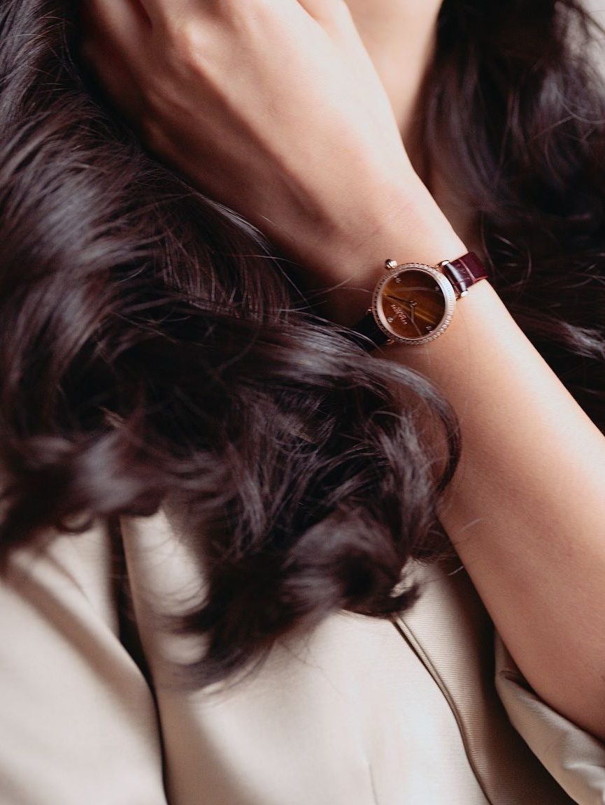 IU CI Studios Portfolio Lola Rose Lifestyle Products 60 second Ad Still Closeup of woman with brown hair with watch on her arm