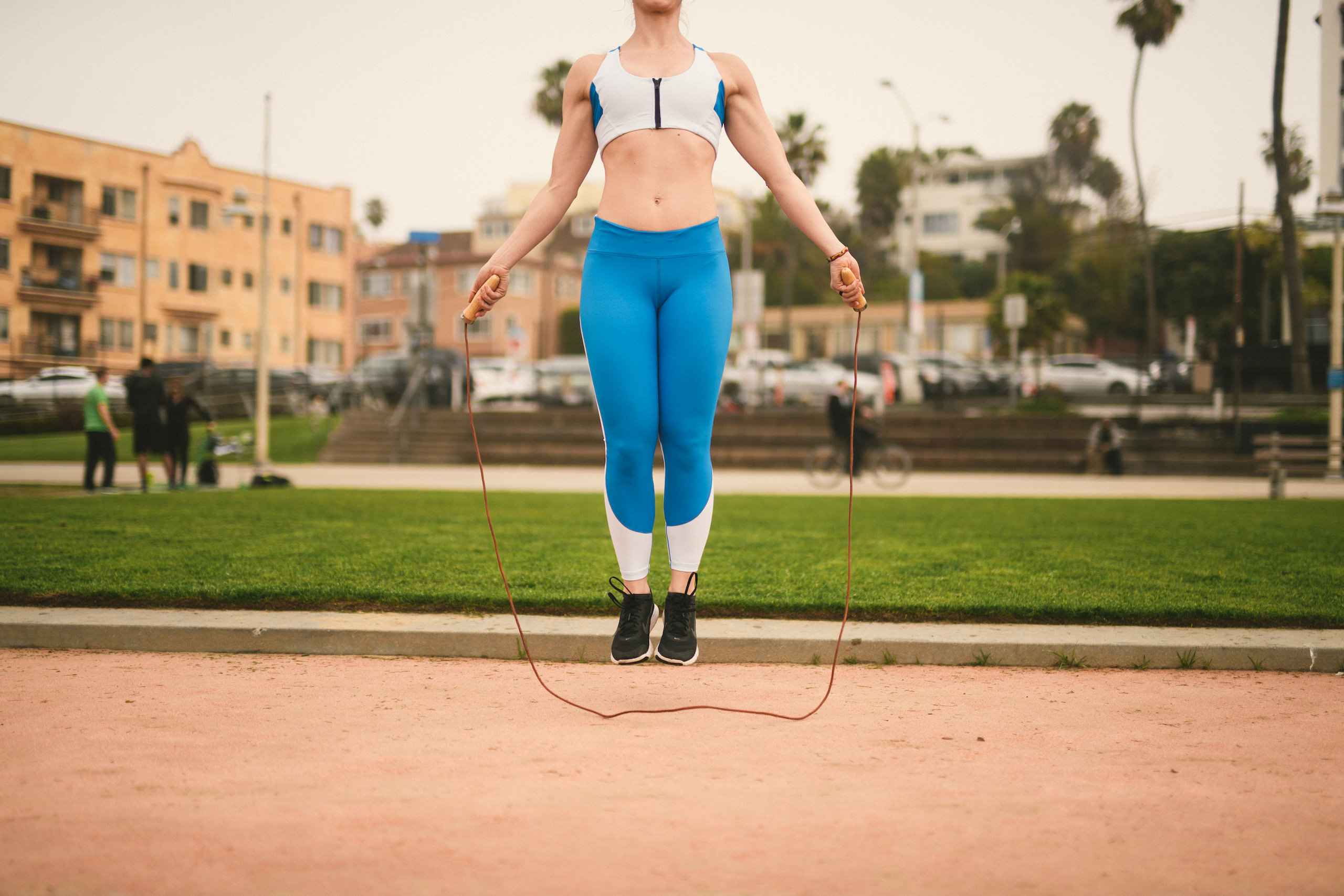Health and Fitness Marketing JSM Closeup of woman jumping rope in a park
