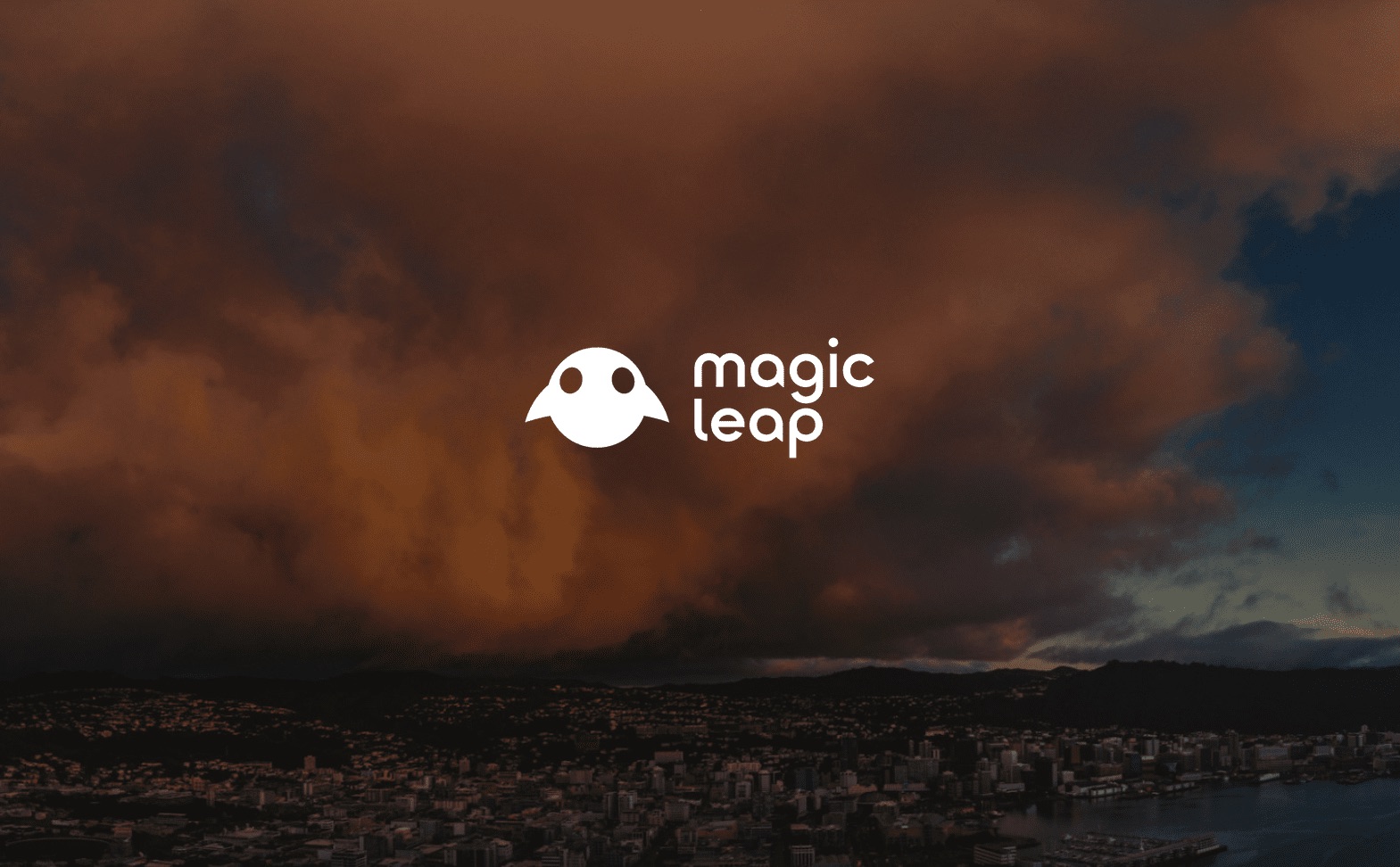 IU C&I Studios Page White Magic Leap Logo with graphic ghost image with reddish orange cloud over city in the background