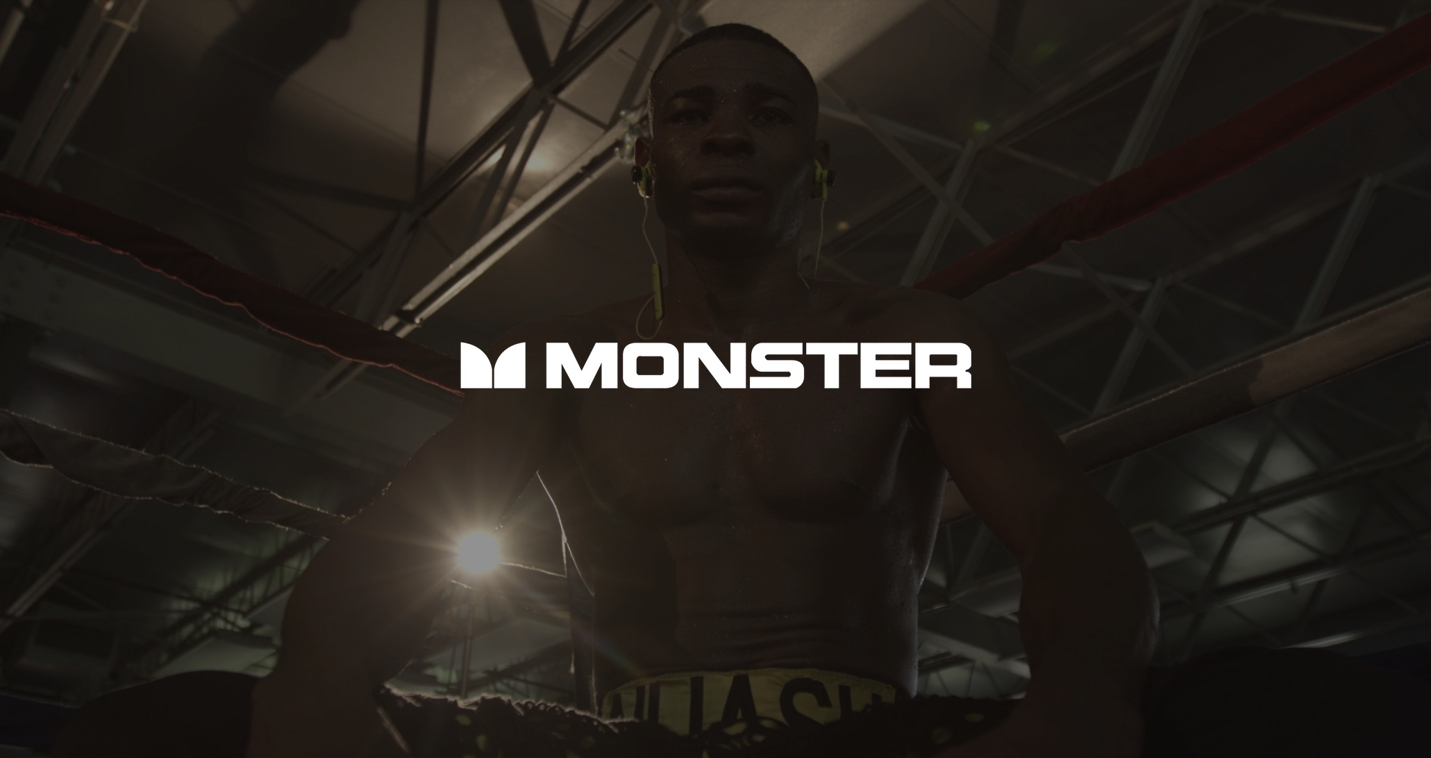 IU C&I Studios Portfolio and Page White Monster Music Cable Logo with dimmed background of African American boxer standing in the corner of a ring