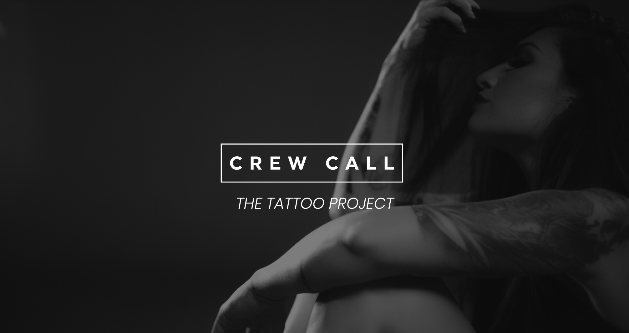 White Crew Call The Tattoo Project logo on black and white background of side profile of a tattooed model