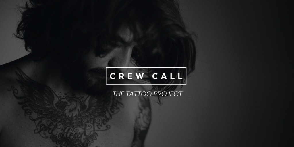 White Crew Call The Tattoo Project logo on black and white background of side profile of a tattooed man looking down